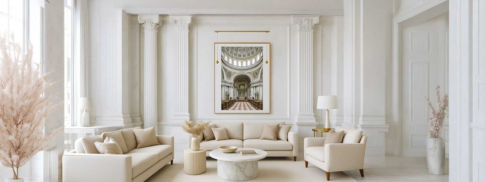 Gold-framed art print of a cathedral interior with domed ceiling and checkered floor, displayed in a white living room with columns and beige sofas.