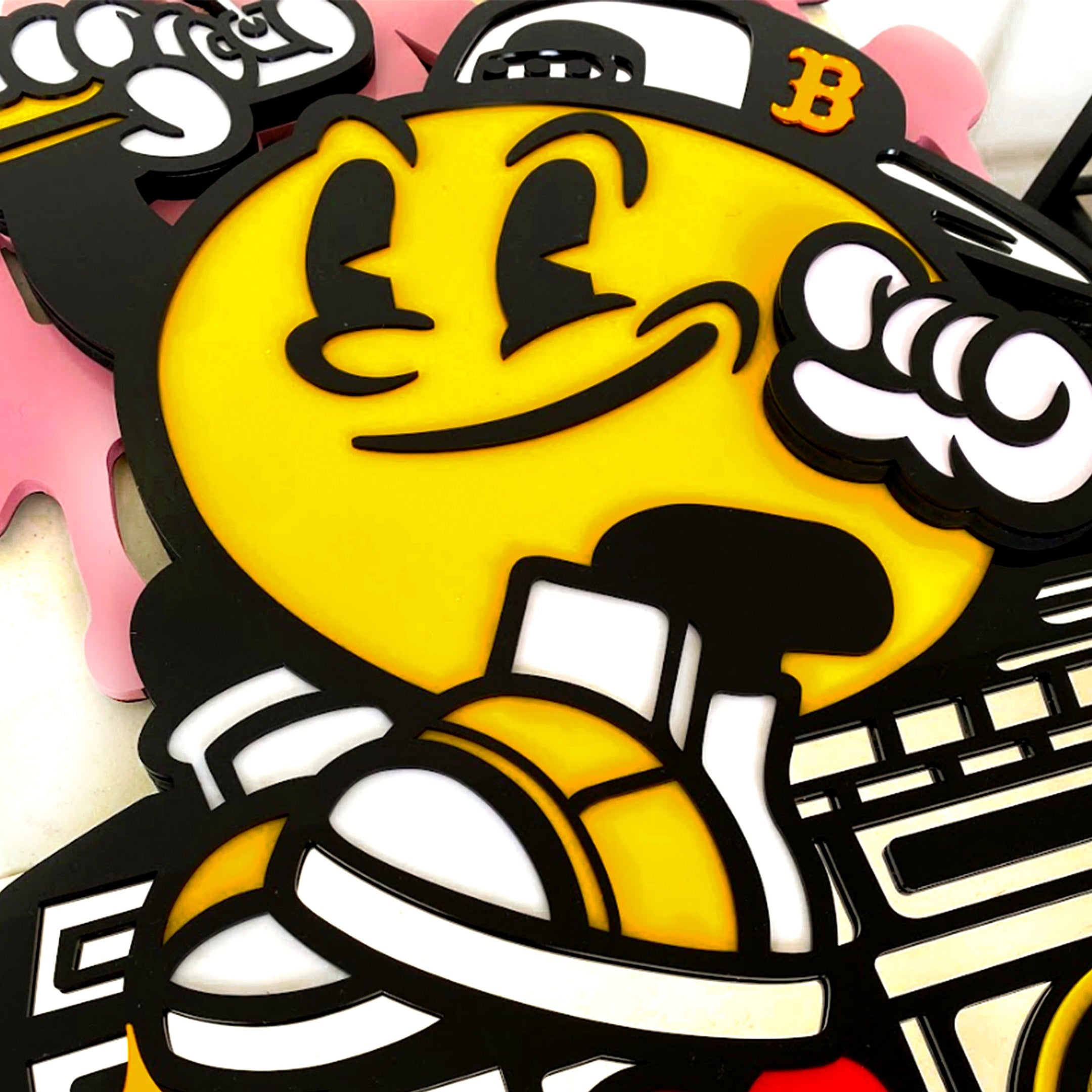 The Spray Your Love 3D Wall Art by Giant Sculptures features a cheerful yellow cartoon character with a big grin, B cap, gloves, and sneakers, posing confidently against a vibrant street-style inspired background.