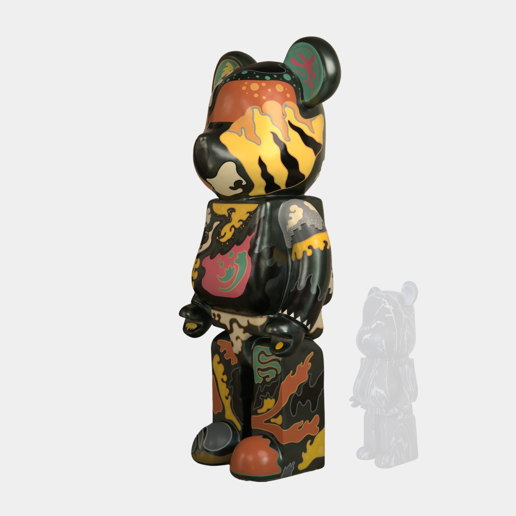 The Inside Appears Outside Bear Sculpture - 50cm by Giant Sculptures is a limited edition piece by Jirayu Tantrakul, featuring green, yellow, orange, and black camouflage with tiger stripes and a smaller grayscale figurine in the background.