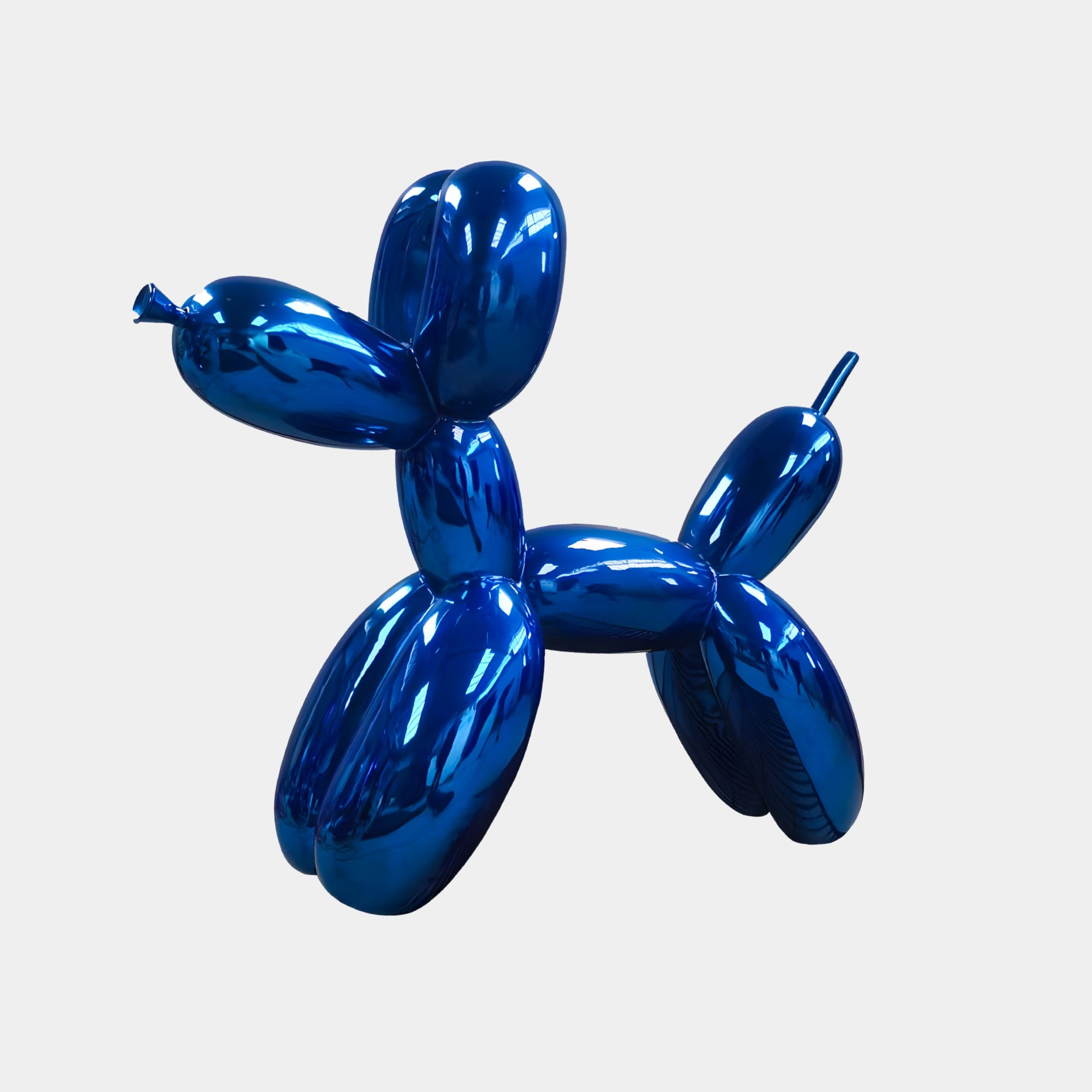 The Giant Sculptures Ocean Blue Balloon Dog Sculpture - 80cm stands on a white background, displaying its shiny, metallic surface and playful, vibrant design.