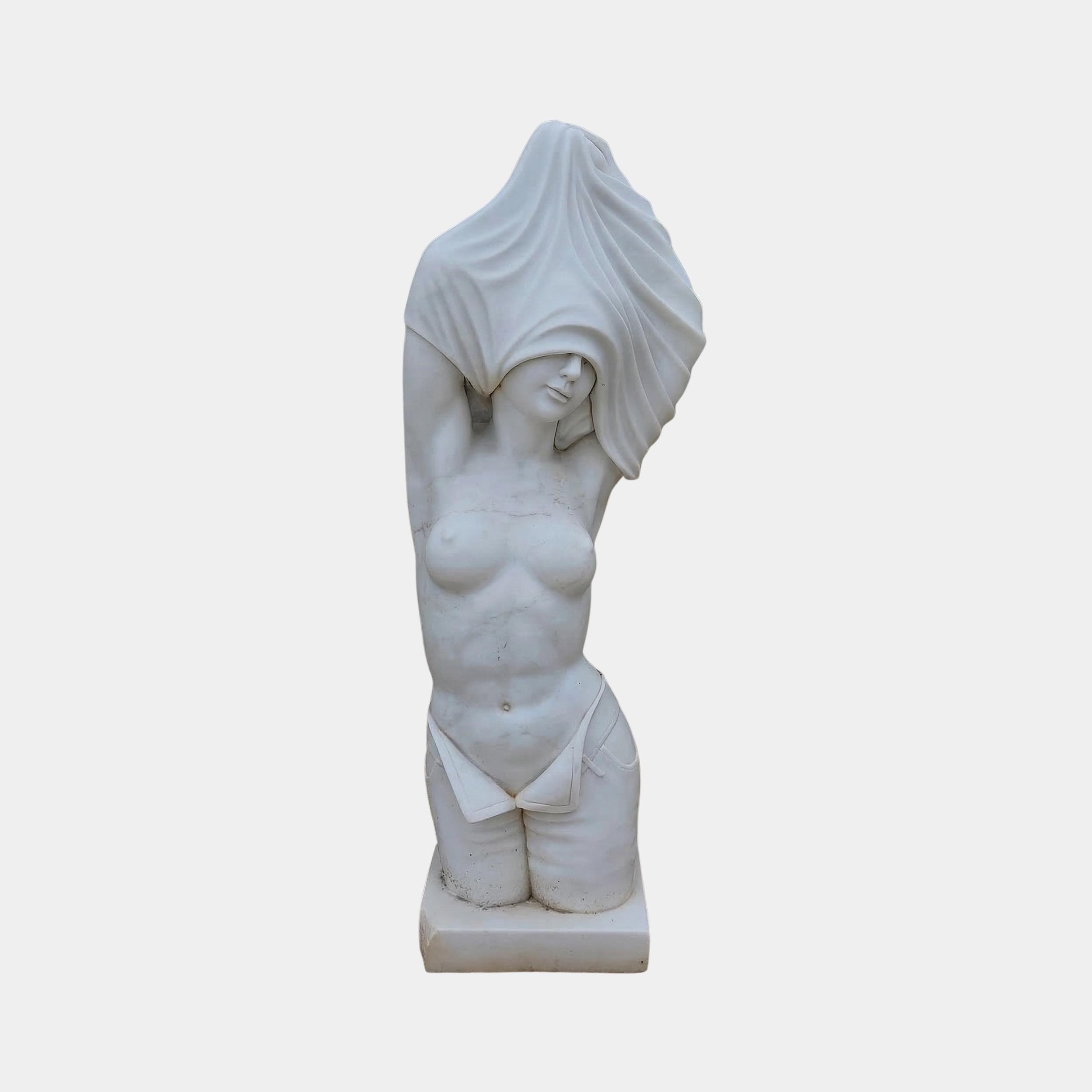 The Female Marble Torso Sculpture - 80cm by Giant Sculptures features a kneeling, topless figure lifting a cloth overhead, with detailed anatomy and draped lower garment, set against a plain background.