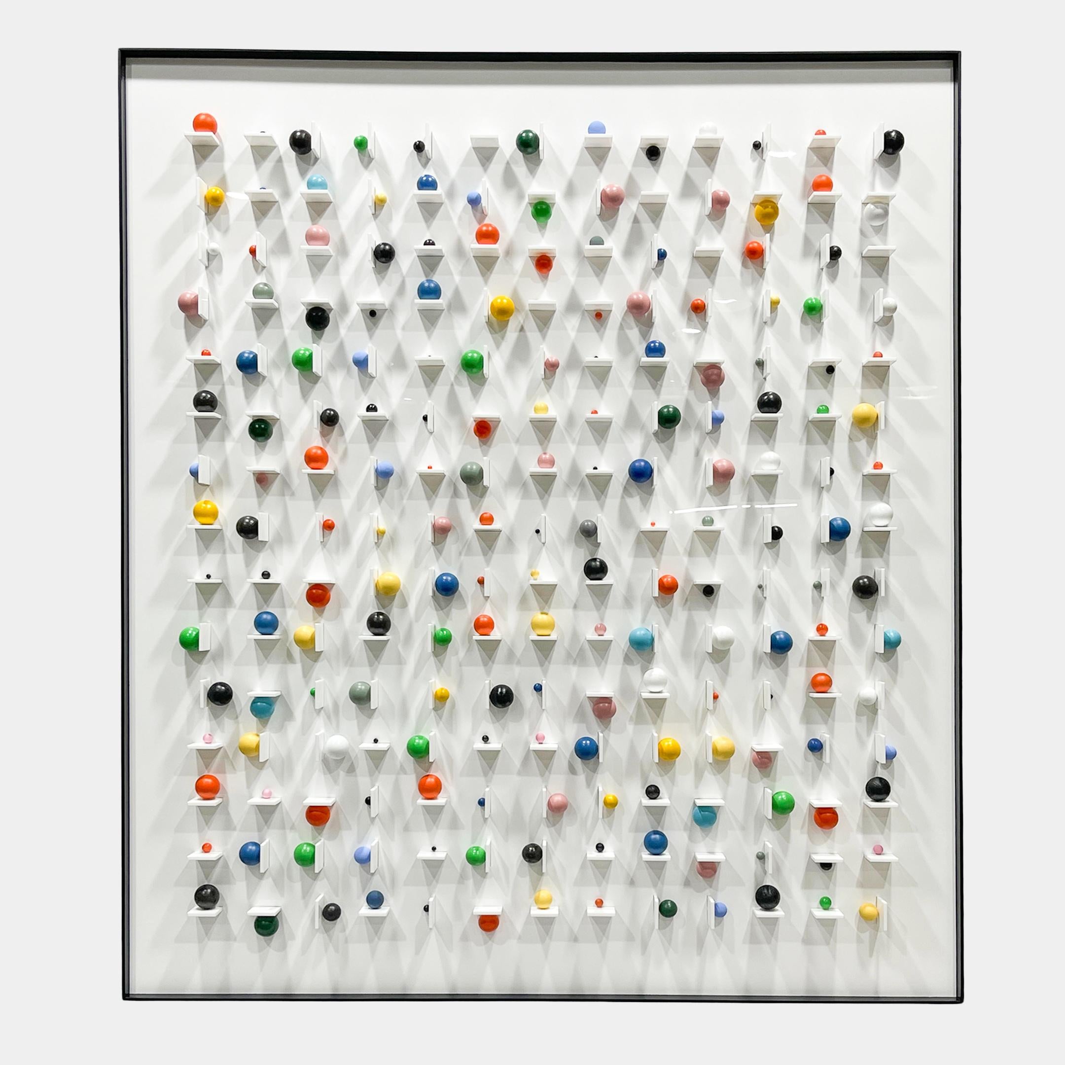 Aeris Multi-Coloured Wooden Sphere 3D Wall Art by Giant Sculptures, framed white grid panel with pegged multicoloured spheres projecting forward in varied sizes.