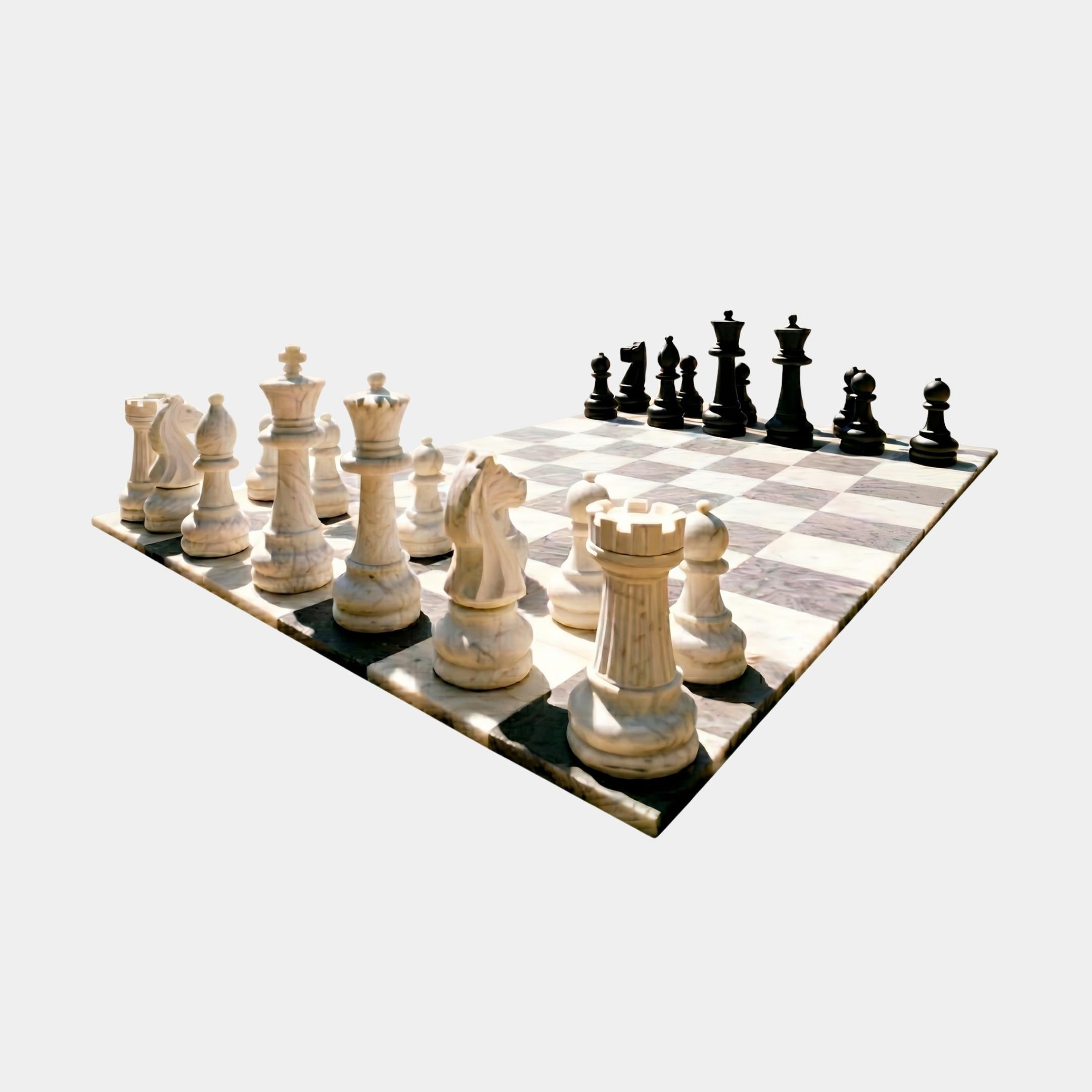 Giant Sculptures 60cm marble chess set with white pieces in the foreground facing black pieces across a checkered white and dark marble board.