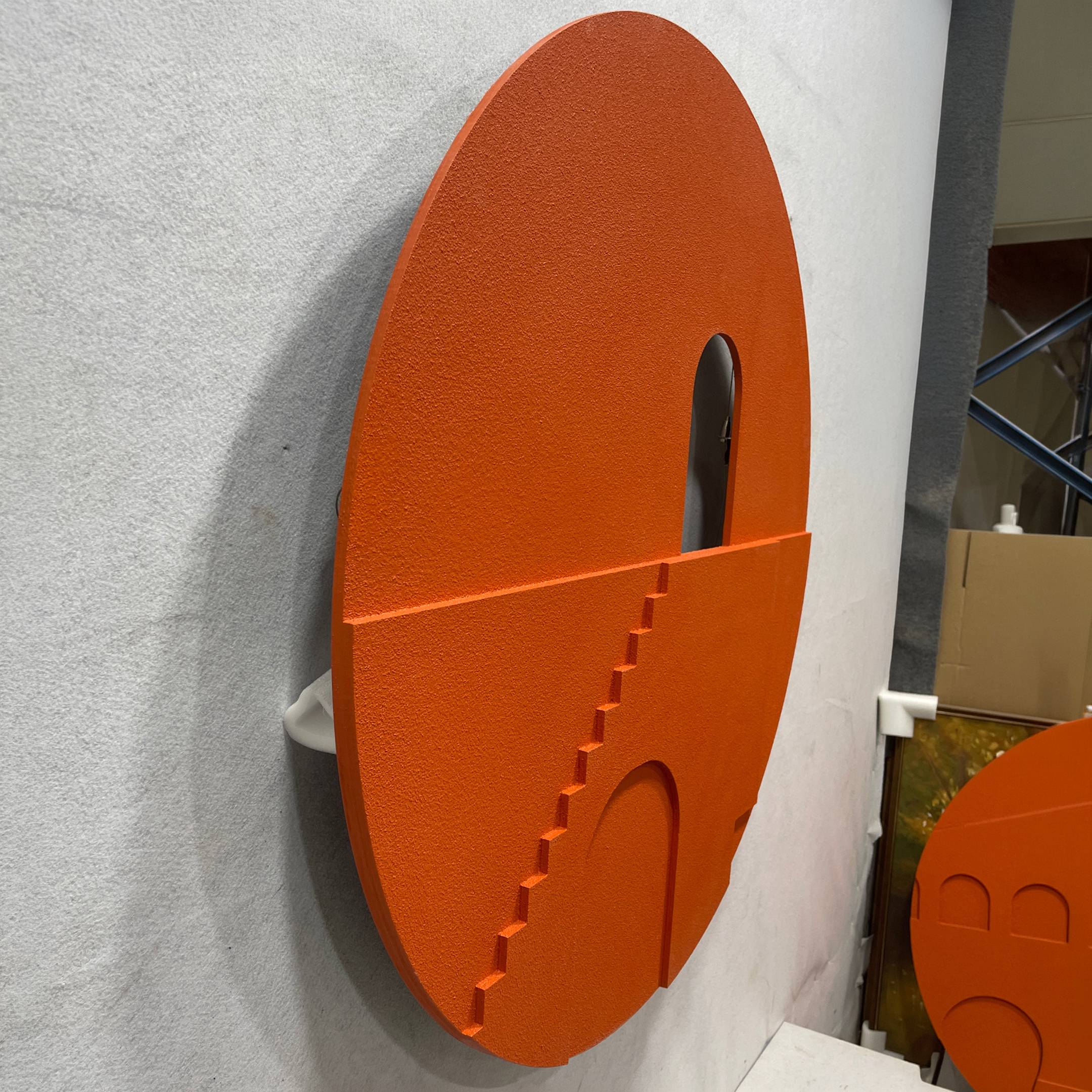 Side angle view of the Arcuza Terracotta III Wood Carving Sandstone 3D Wall Art showing its textured matte surface, arched cut-out, and carved stair detail.