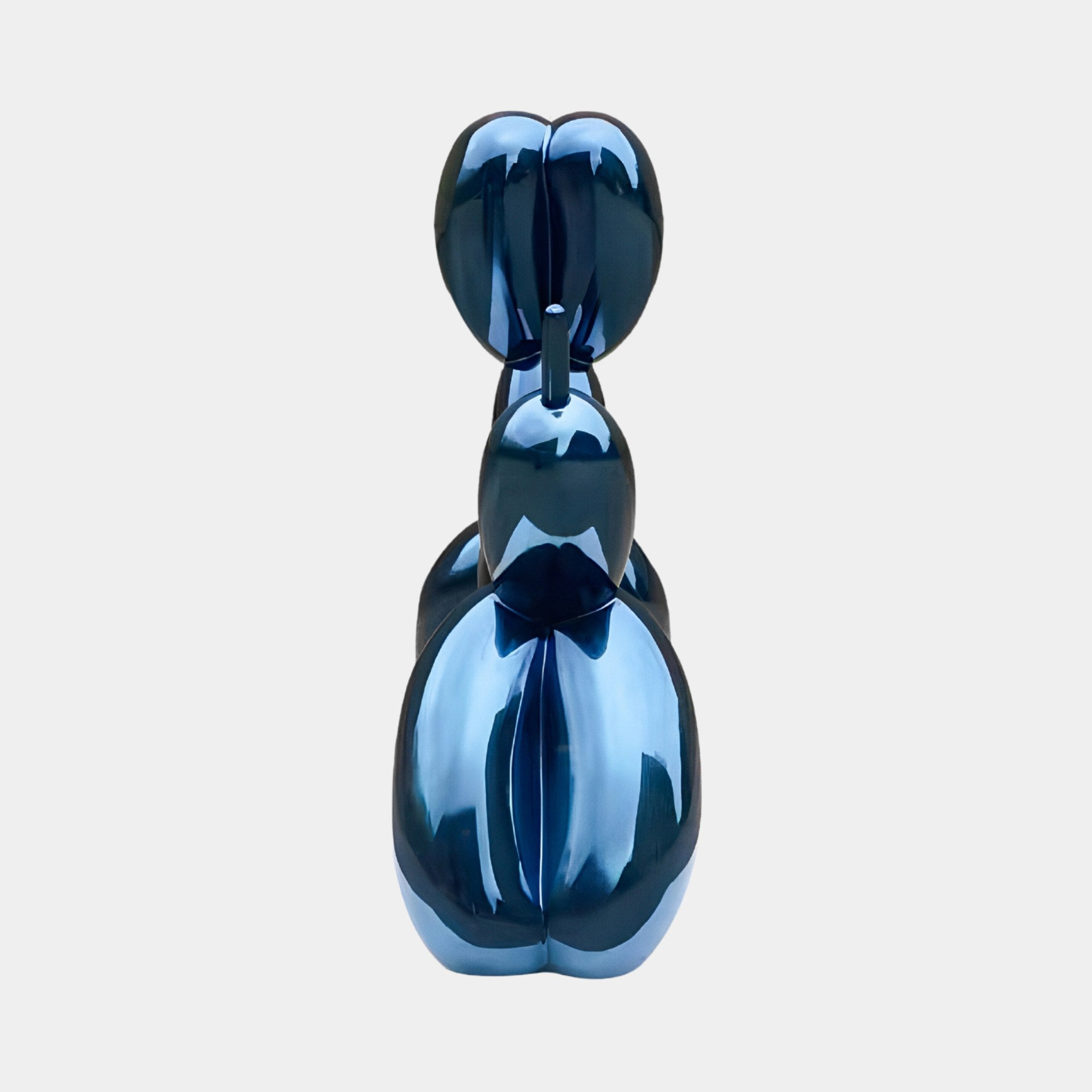 The Sapphire Blue Balloon Dog Sculpture - 130cm by Giant Sculptures features a shiny, electroplated finish enhancing its reflective surface. Viewed from the back against a plain white background, its playful and artistic form showcases contemporary sophistication.