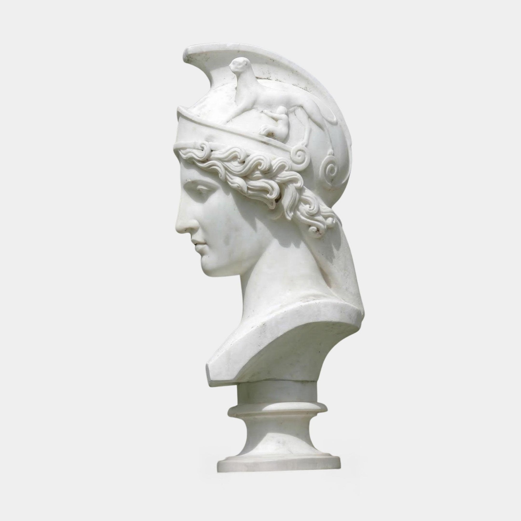 The Athena Marble Bust Sculpture by Giant Sculptures (65cm) features an ancient Greek helmeted figure in profile with an animal-adorned, decorative helmet, set against a plain light background.