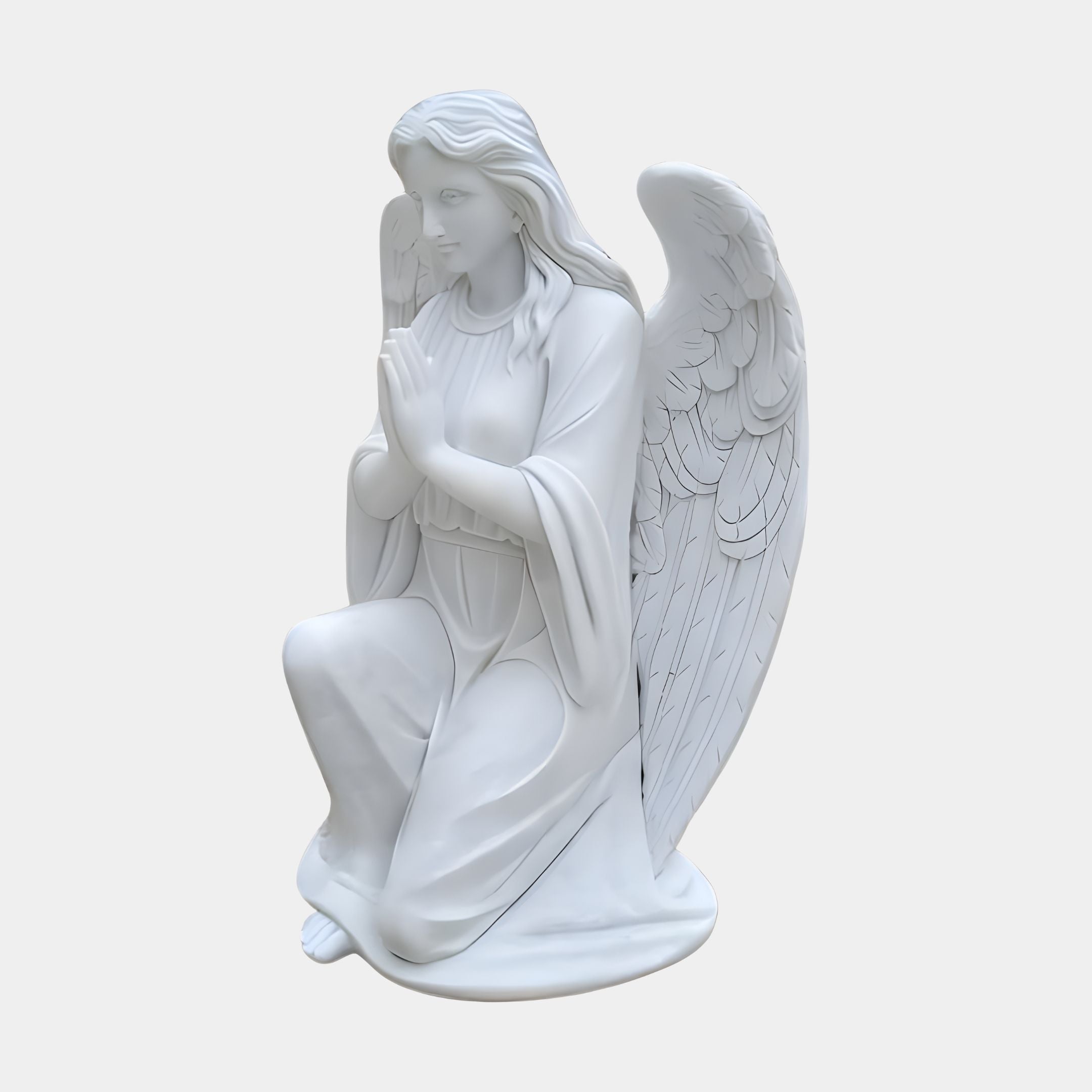 The Humble Kneeling Angel Marble Outdoor Sculpture by Giant Sculptures features a 130cm angel with long hair, detailed wings, and a serene expression. Dressed in flowing garments, this white statue is depicted kneeling with hands in prayer.