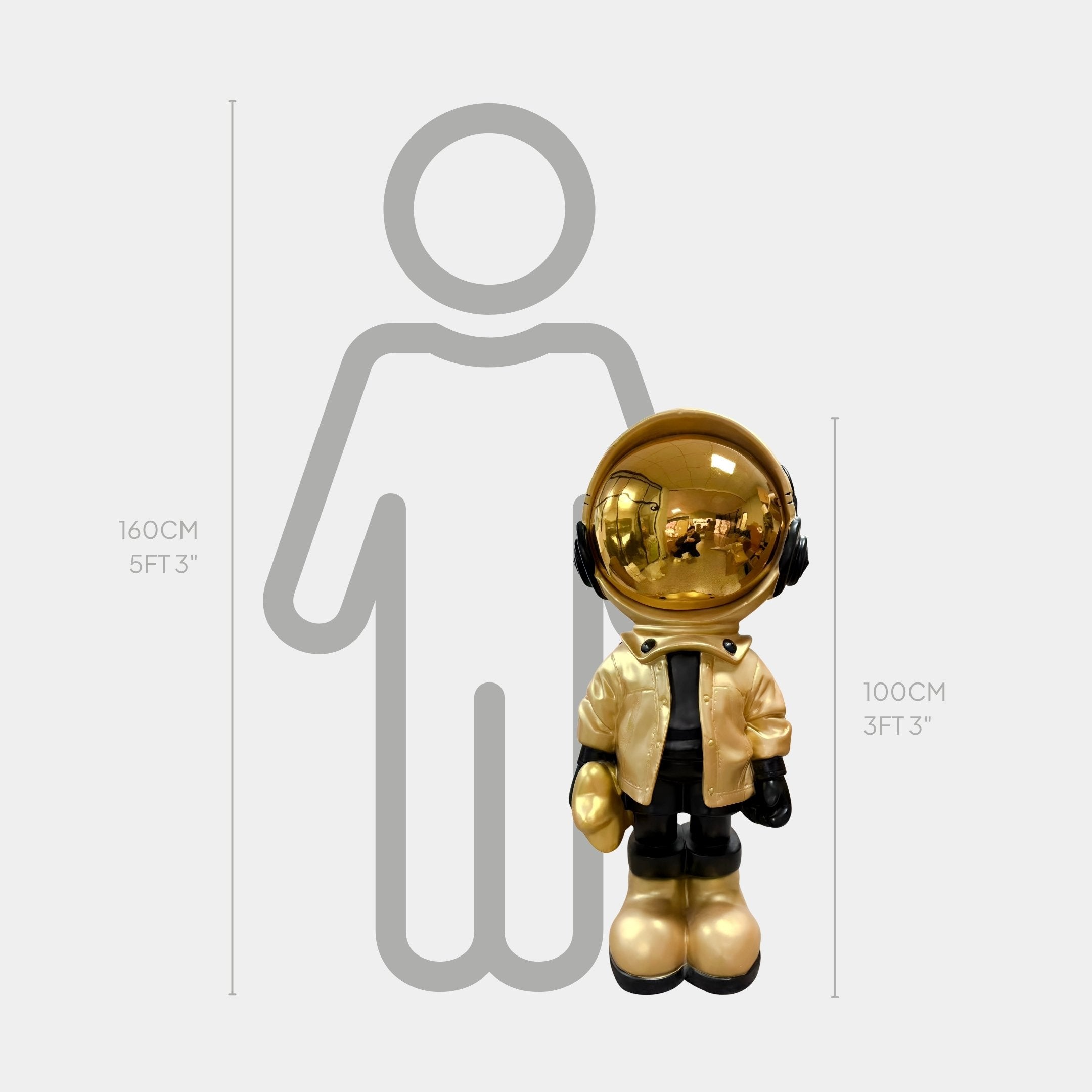The Celestial Gold Astronaut Beats Sculpture by Giant Sculptures, standing at 100 cm (3 ft 3 in), is displayed next to a 160 cm (5 ft 3 in) person outline for scale.