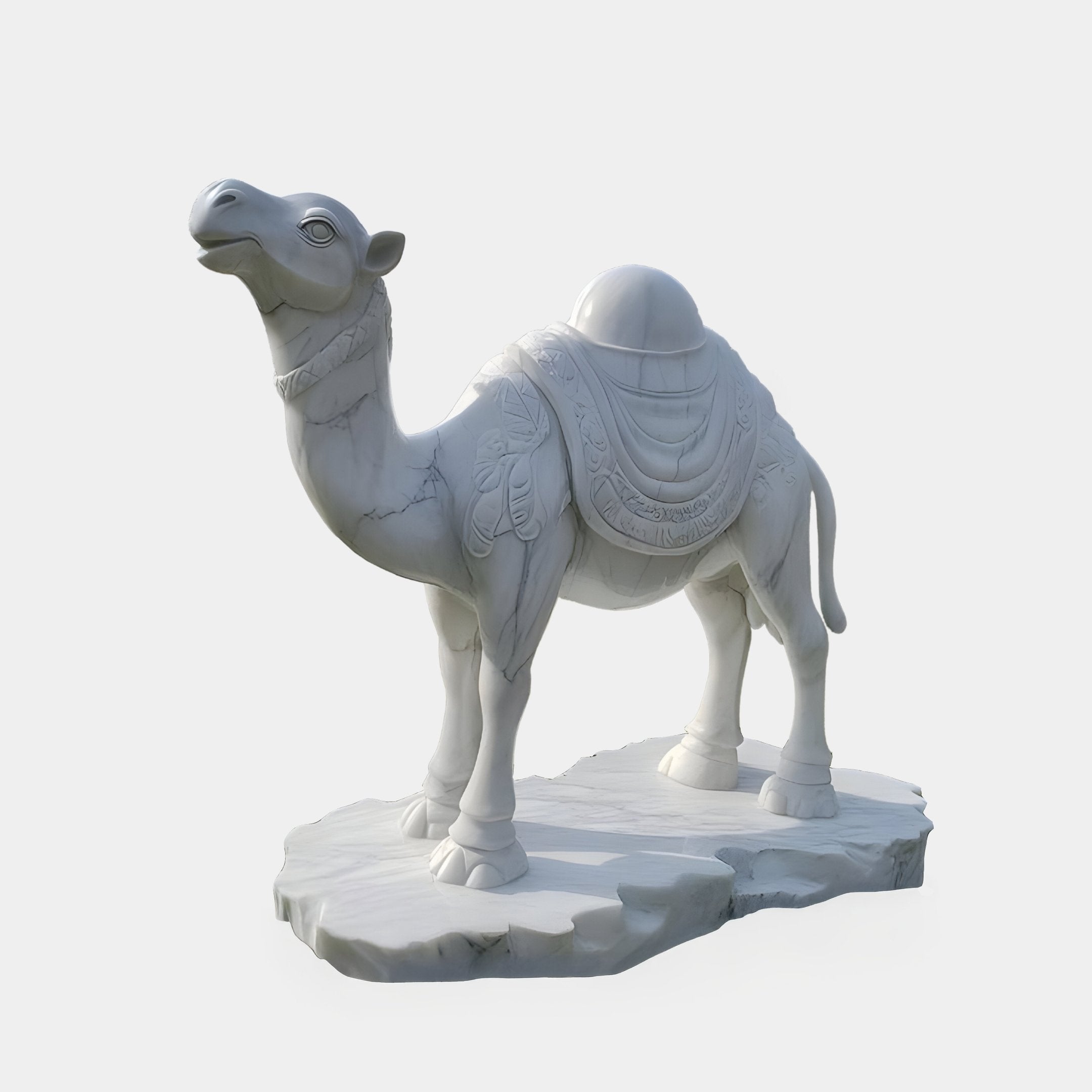 The Saddled Standing Camel Marble Outdoor Sculpture by Giant Sculptures, standing at 220cm, features a white marble camel with a decorative saddle and intricate hand-carved details, poised in an upward-looking stance on a textured base.