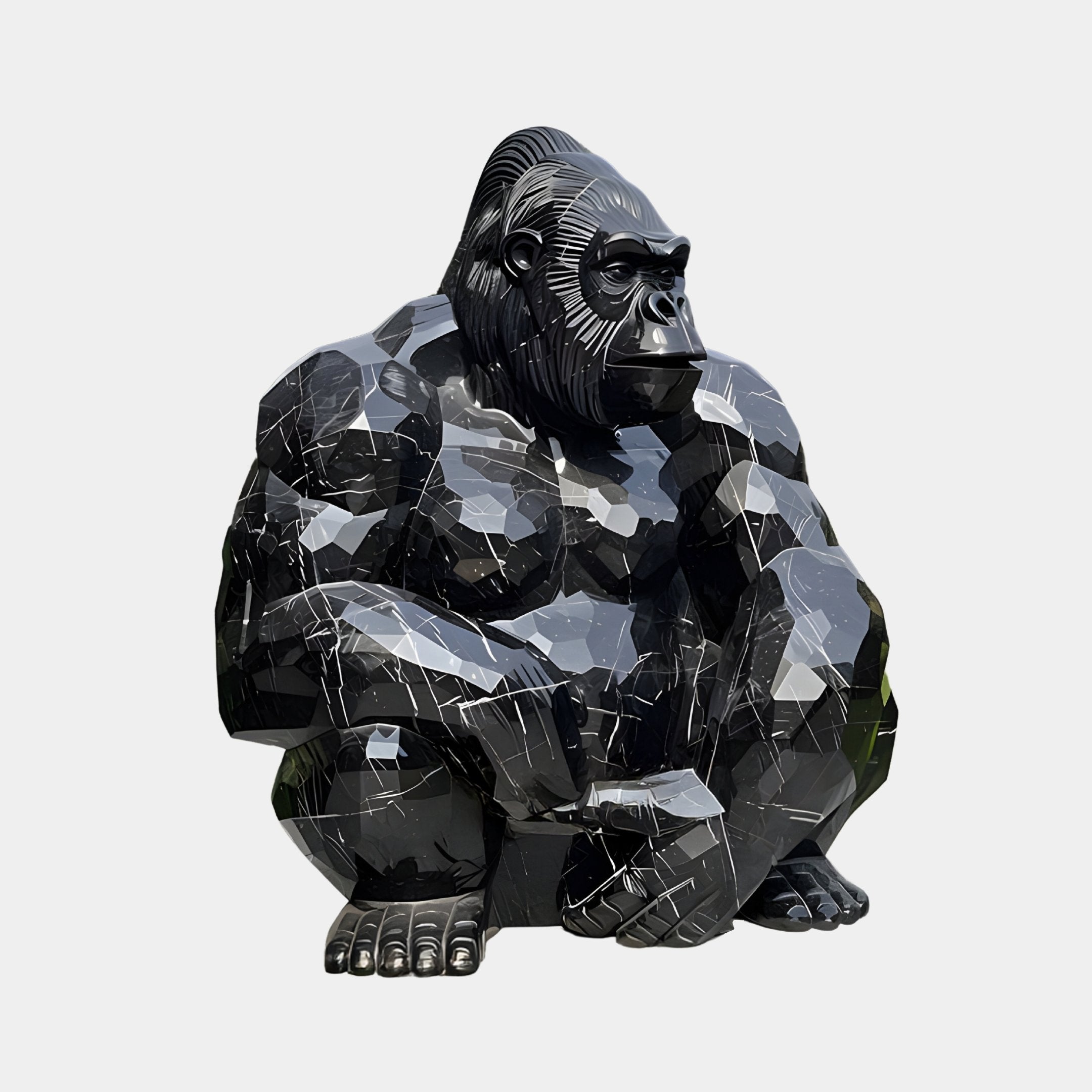 The Onyx Crouching Gorilla Marble Outdoor Sculpture by Giant Sculptures boasts shiny black surfaces and angular facets, offering a sleek, modern appearance that enhances any space with its geometric design.
