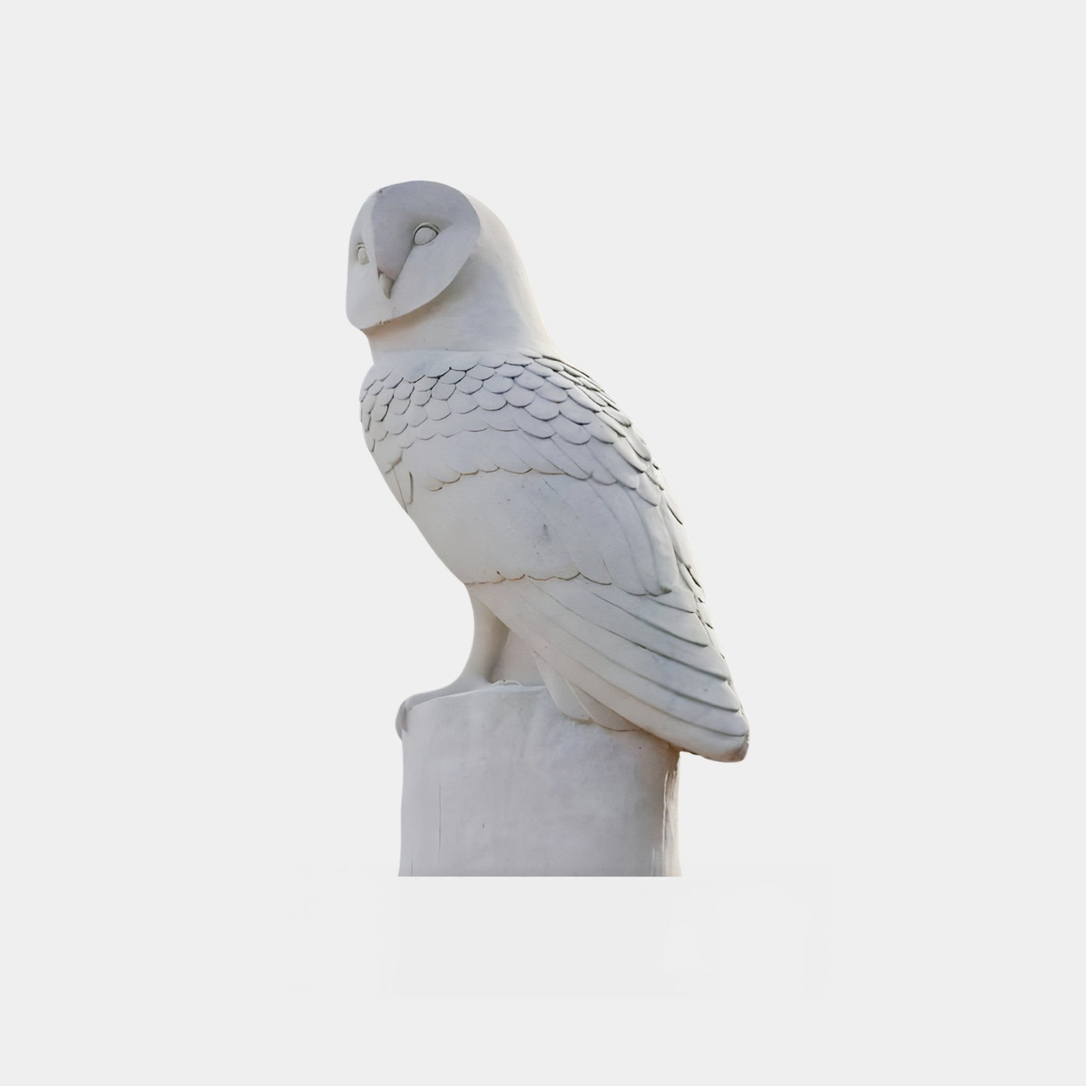 The Watchful Owl Marble Outdoor Sculpture by Giant Sculptures features a detailed feather-carved owl on a cylindrical base. This hand-carved 40cm white marble piece stands out against a plain light gray background, perfect for garden decor.