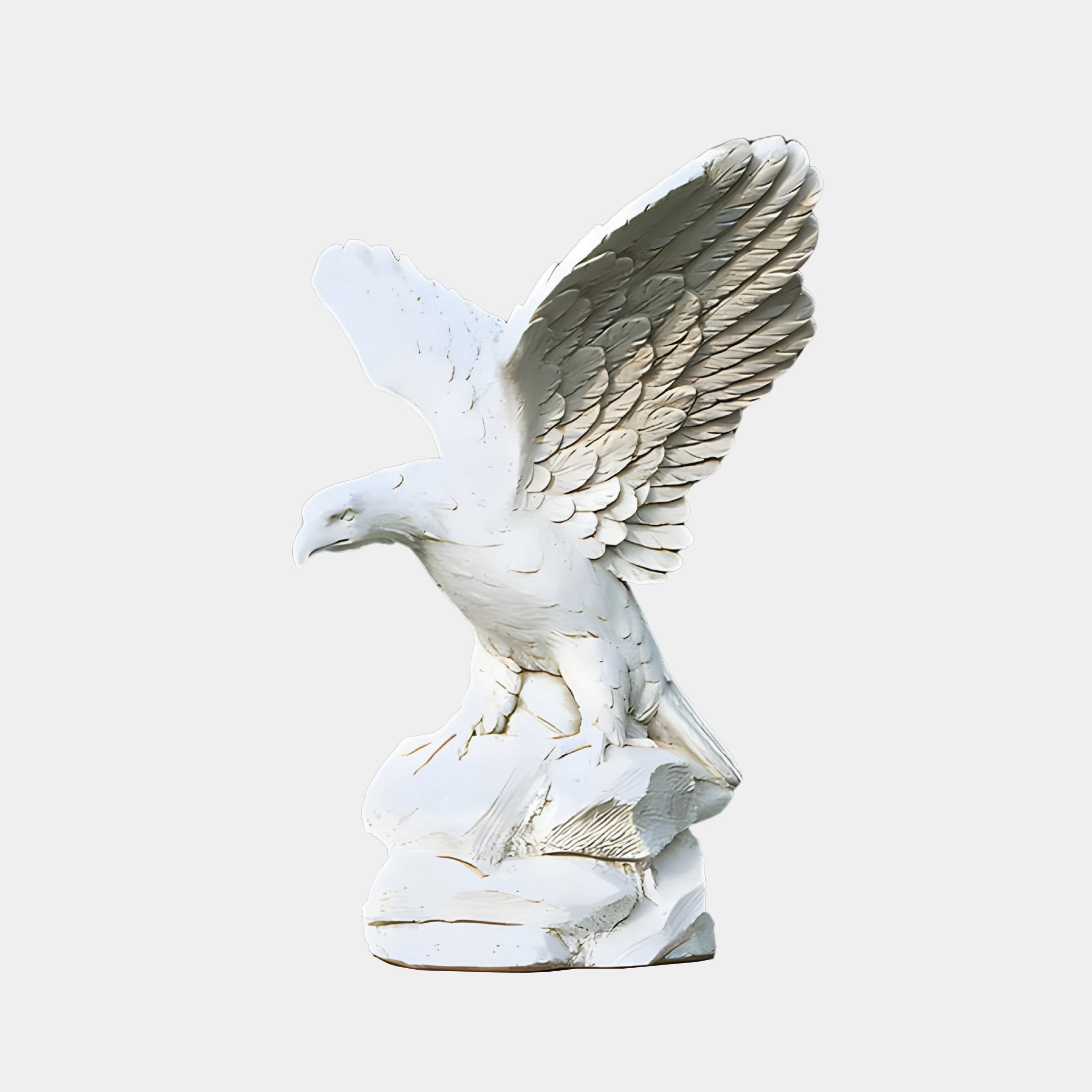 The Rock-Perched Eagle Marble Outdoor Sculpture - 120cm by Giant Sculptures showcases detailed feathers and partially spread wings on a rocky base, set against a plain light gray backdrop. Ideal as a garden statue, its majestic presence is perfect for outdoor display.