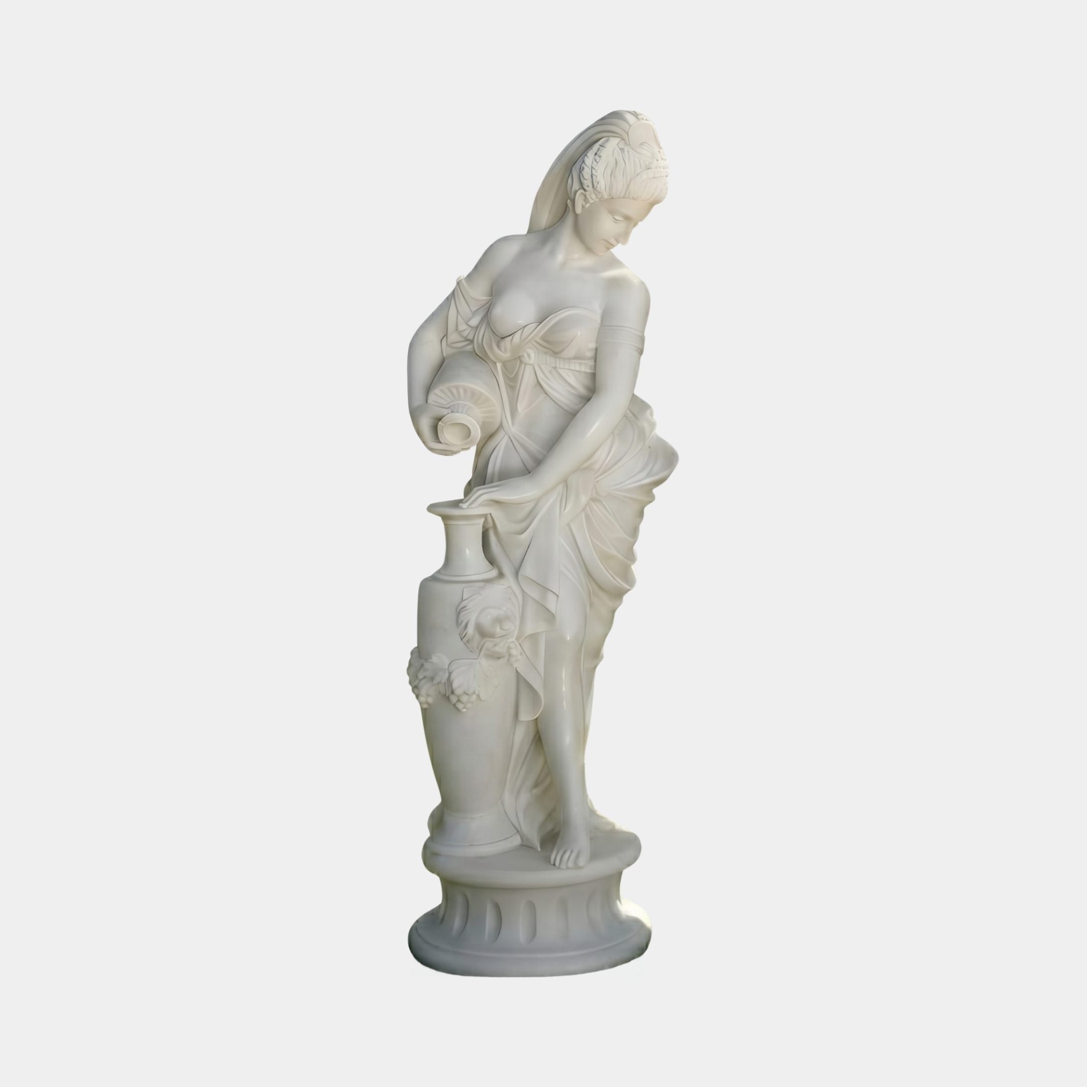 Water Nymph Marble Sculpture 180cm by Giant Sculptures, depicting a draped female figure pouring water from a jug onto an urn, set on a round pedestal.