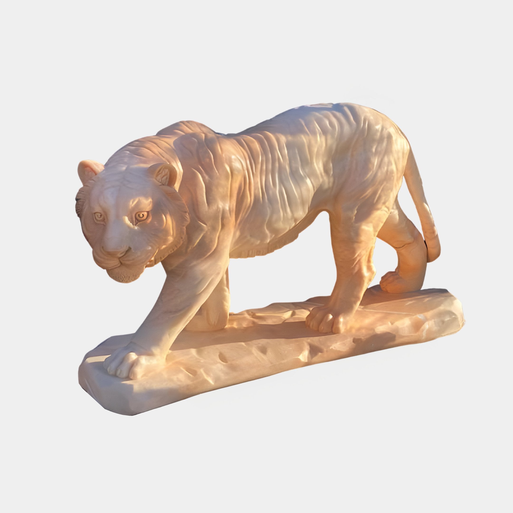 The Striding Tiger Yellow Marble Outdoor Sculpture by Giant Sculptures is a stunning 60cm piece featuring intricate details and textured fur, depicting a lifelike tiger mid-stride on a rectangular base.