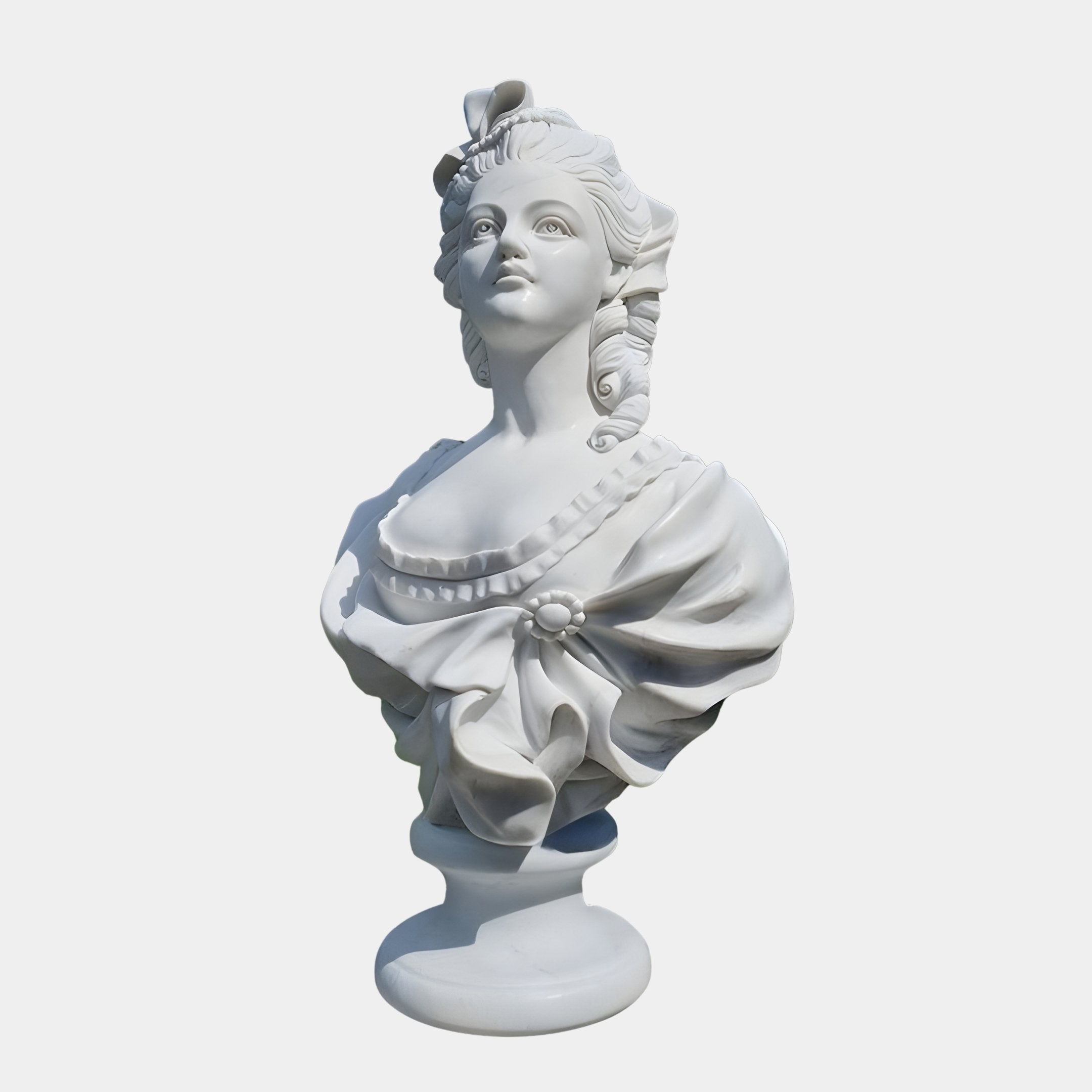 The Baroque Lady Marble Bust Sculpture (65cm) by Giant Sculptures features a white marble woman with elaborate curls, a decorative dress with a large bow and pearl detail, gazing upward against a plain white background.