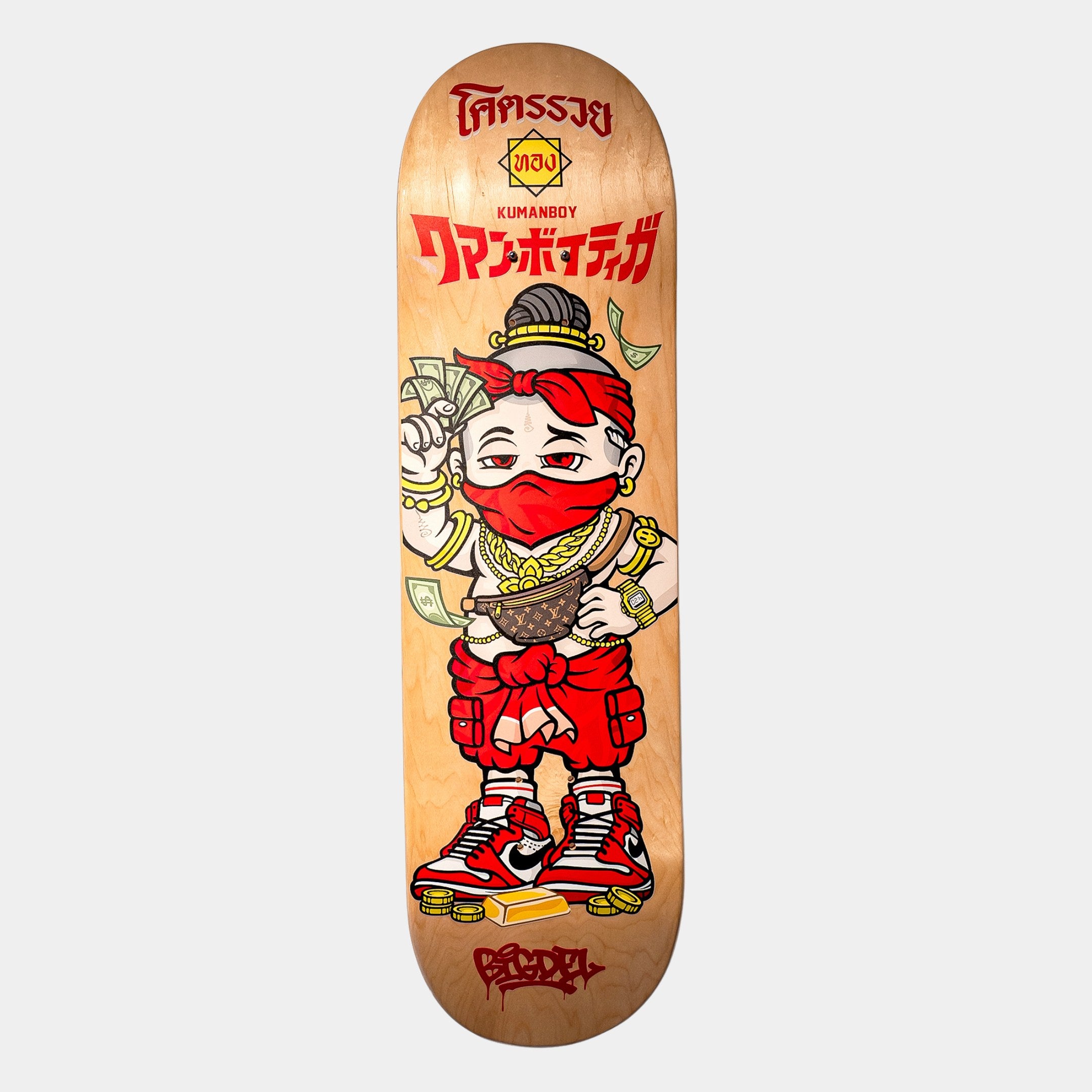 The Kuman Boy Deck Vol.2 Skateboard Wall Art by Giant Sculptures features a cartoon character in red clothes, mask, and gold chains holding cash, standing on coins with stylized text—ideal for contemporary decor.