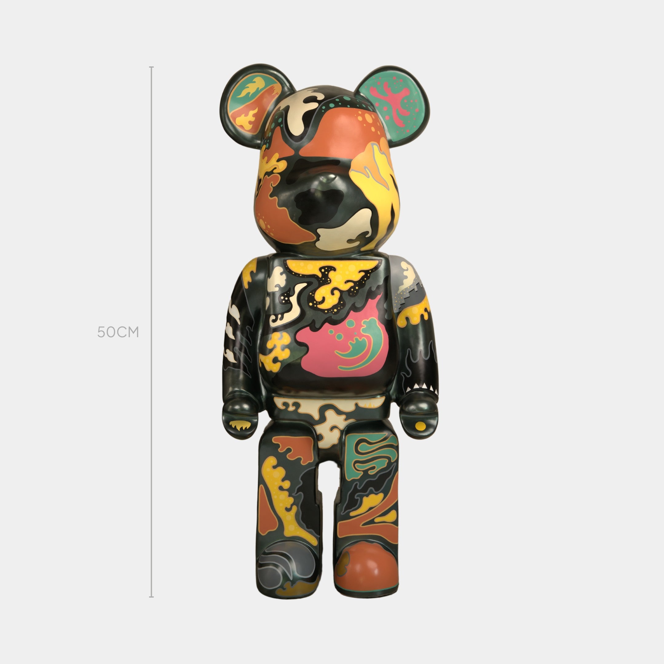 The Inside Appears Outside Bear Sculpture - 50cm by Giant Sculptures features abstract, colorful yellow, orange, green, pink, and black patterns. This limited edition piece by Jirayu Tantrakul stands against a plain white background.