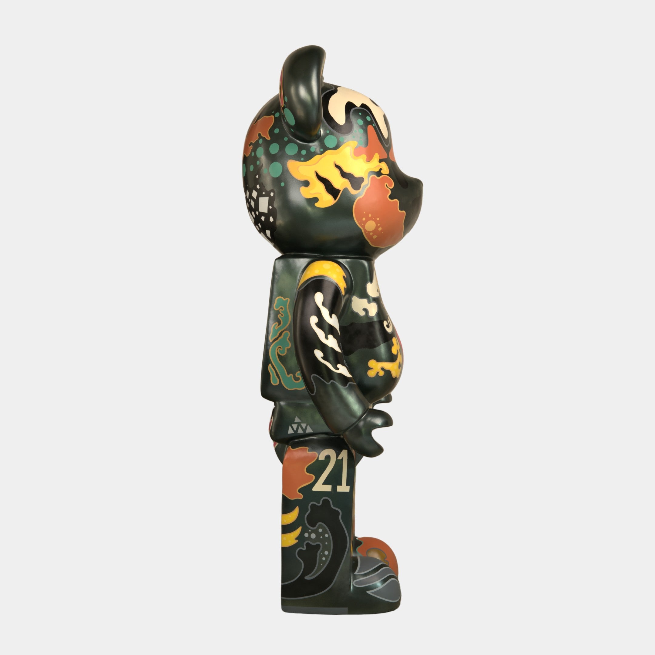 A side view of the 165cm Inside Appears Outside Bear Sculpture by Giant Sculptures, hand-painted with intricate, colorful swirling patterns, fire-like designs, and the number 21 on its leg, set against a plain white background.