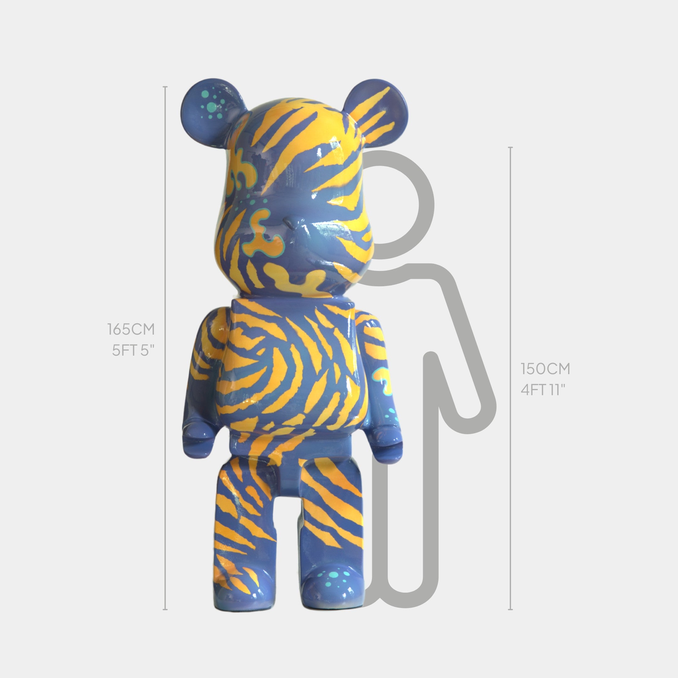 The Inside Appears Outside 2 Bear Sculpture - 165cm by Giant Sculptures features blue and yellow tiger-like stripes and stands before a gray height chart marked at 165 cm (5’5”) and 150 cm (4’11”) for scale—a striking resin artwork.