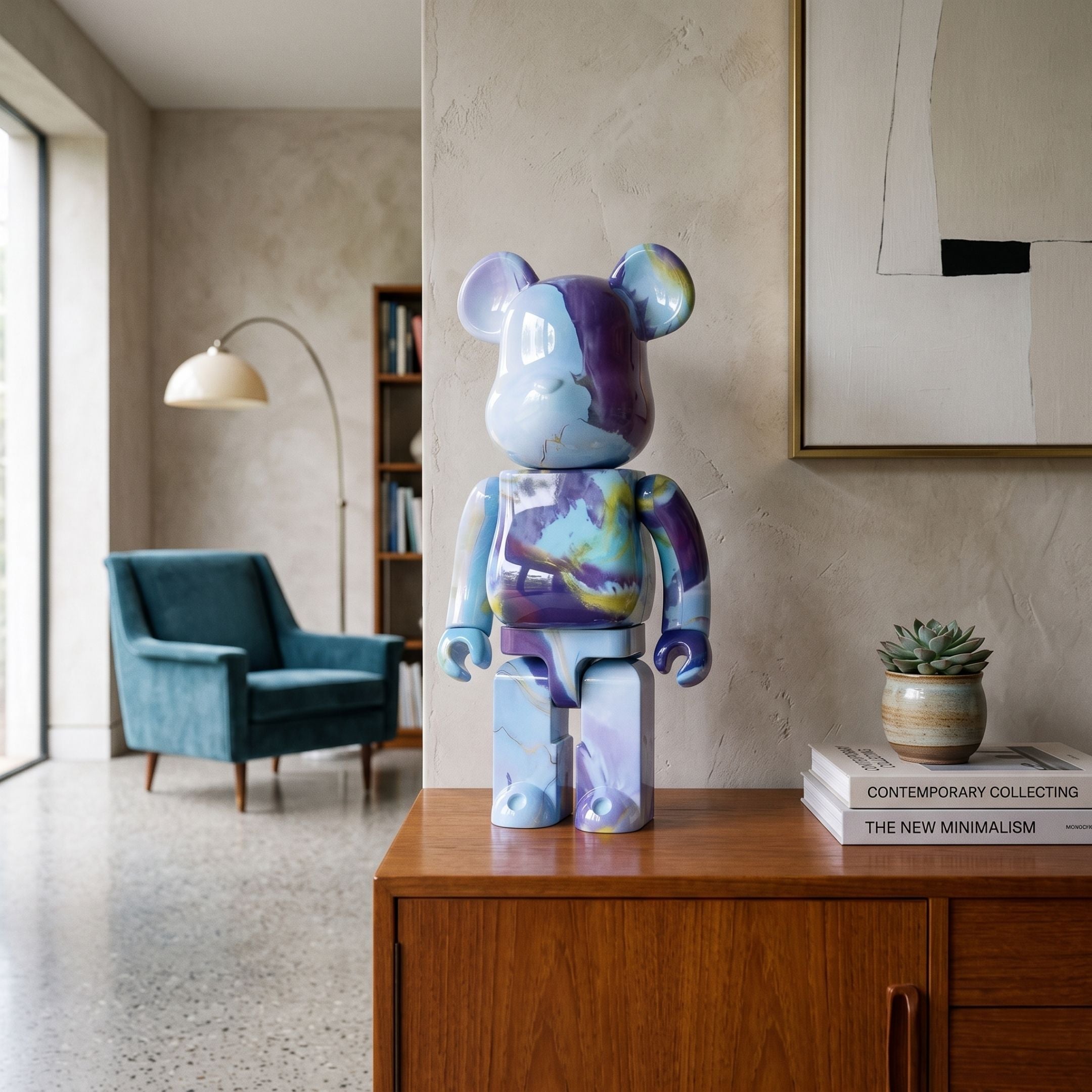 Abstract Swirl Bear Sculpture, 70cm, high-gloss blue, purple, and yellow marbled finish, standing on a wooden sideboard in a living room with a teal armchair and bookshelf nearby.