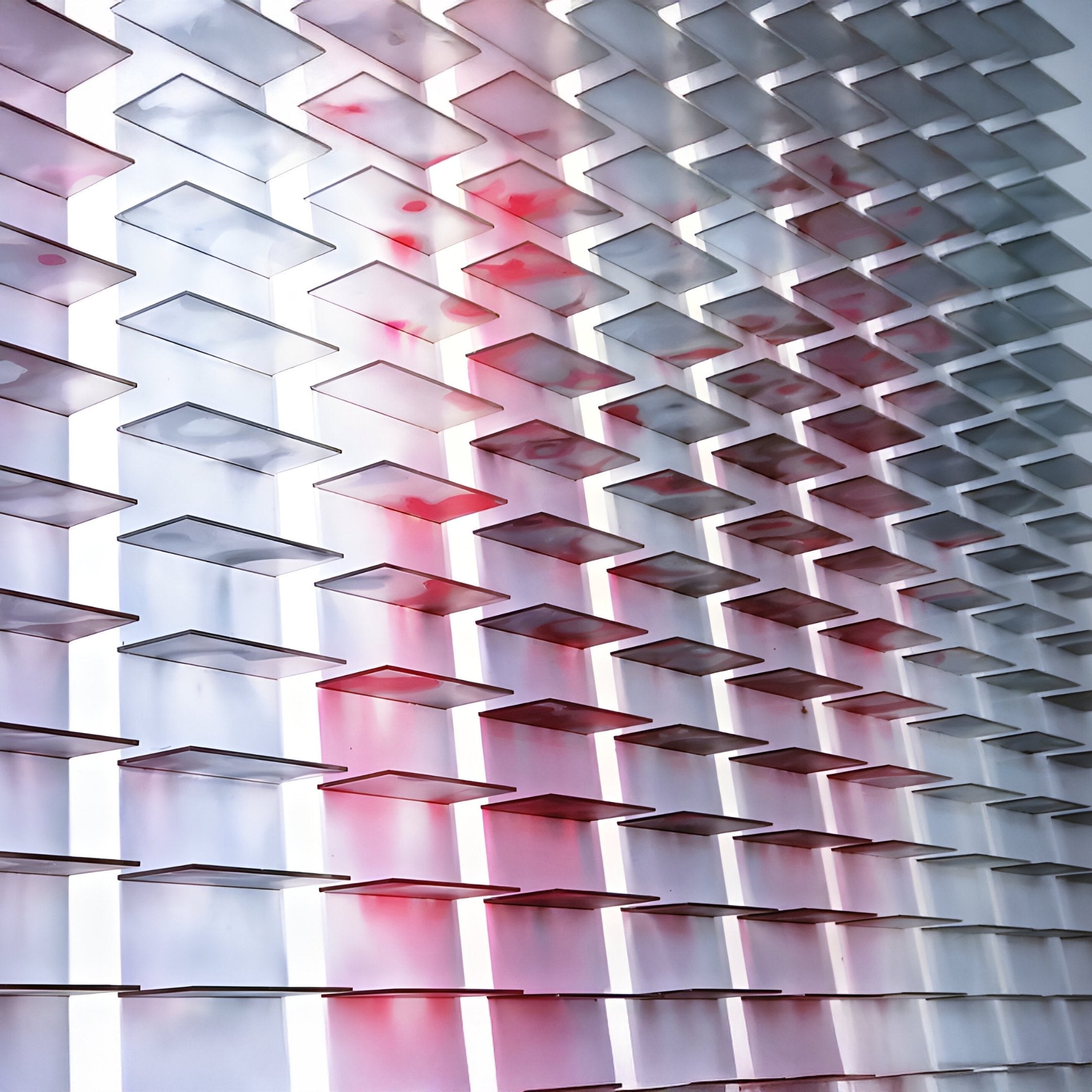 The Chromat Orchid Blush Fade Acrylic 3D Wall Art by Giant Sculptures features overlapping translucent panels in white and pink, lit from behind to create glowing horizontal gradients—an ideal piece of contemporary wall decor.