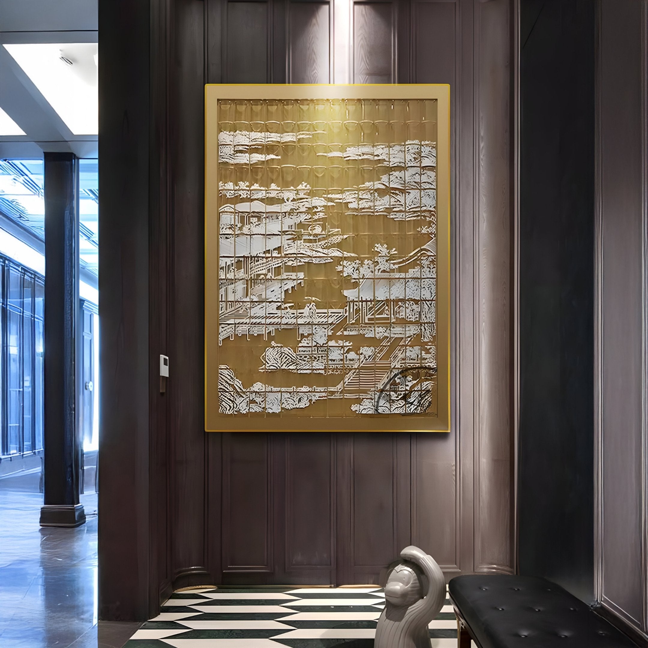 The Dynasty Dark Gold Landscape Framed Acrylic 3D Wall Art by Giant Sculptures hangs on a wood-paneled wall in a modern hallway with patterned floors and a nearby sculptural decor piece, showcasing intricate white architectural designs.
