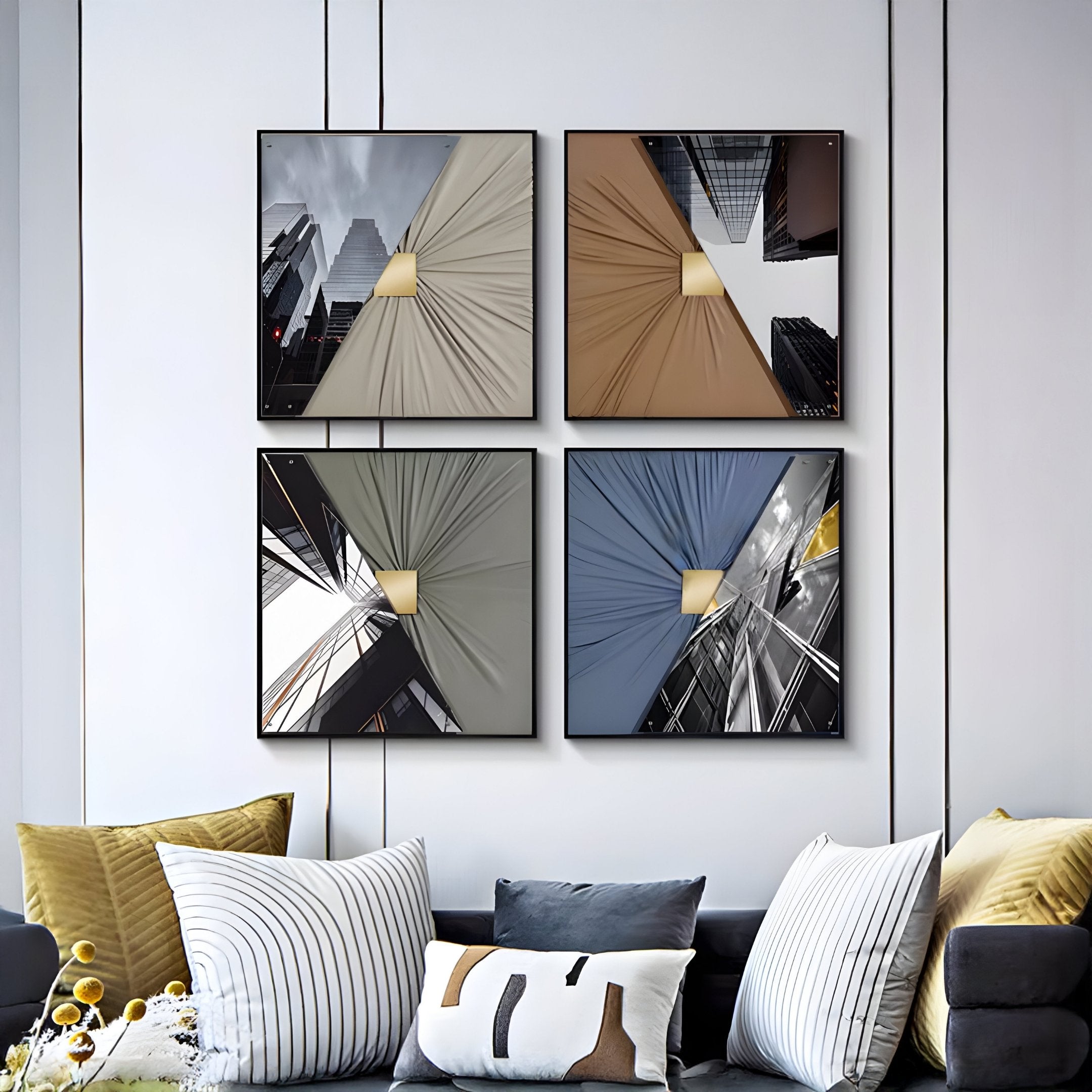 The Urbanist 4-Set Reflected Towers Acrylic & Leather 3D Wall Art by Giant Sculptures features framed cityscapes in a grid above a modern sofa with white, yellow, and gray cushions, adding stunning texture to any contemporary space.