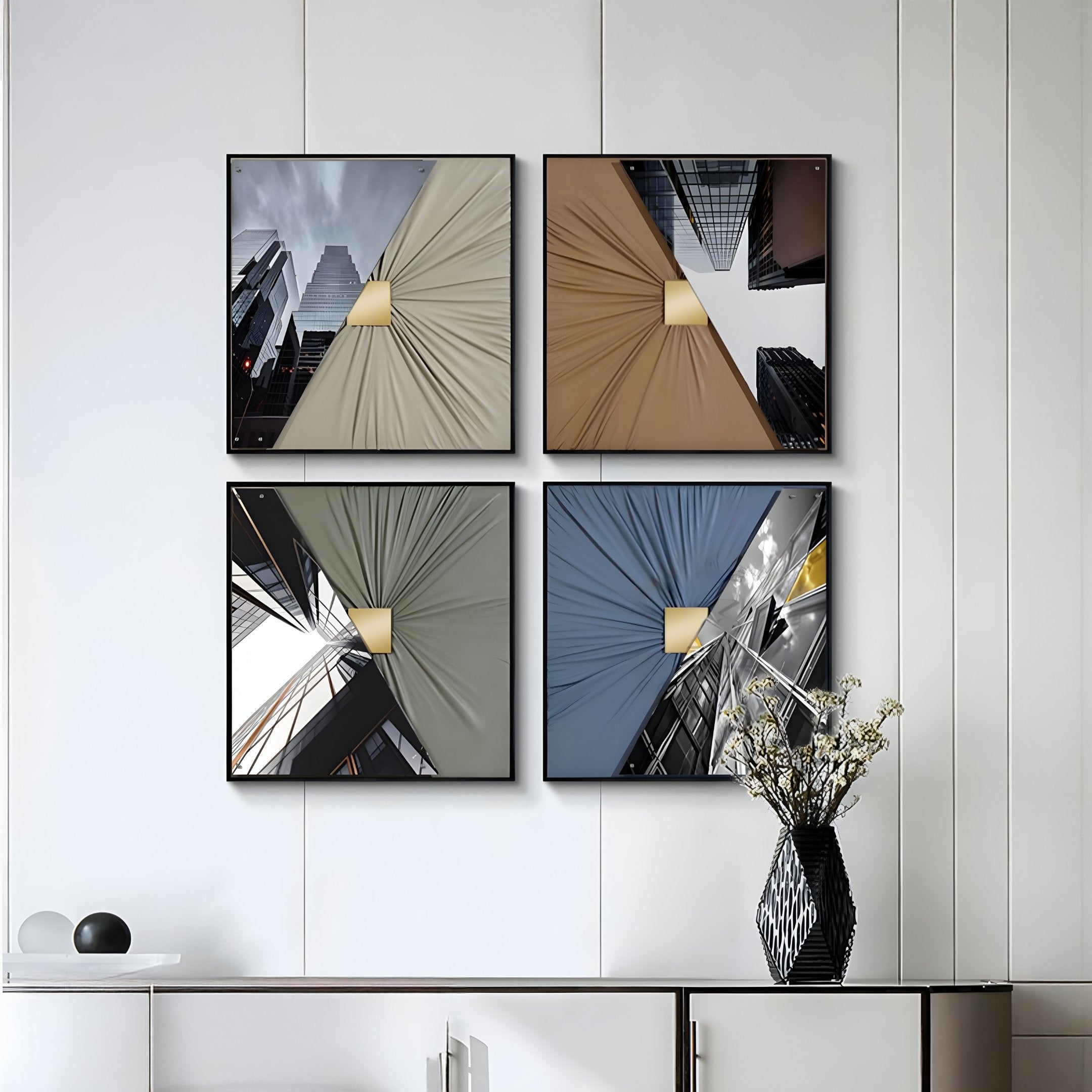 The Urbanist 4-Set Reflected Towers Acrylic & Leather 3D Wall Art by Giant Sculptures features geometric cityscapes above a cabinet with a vase, adding sleek, modern style and depth to your minimalist space.