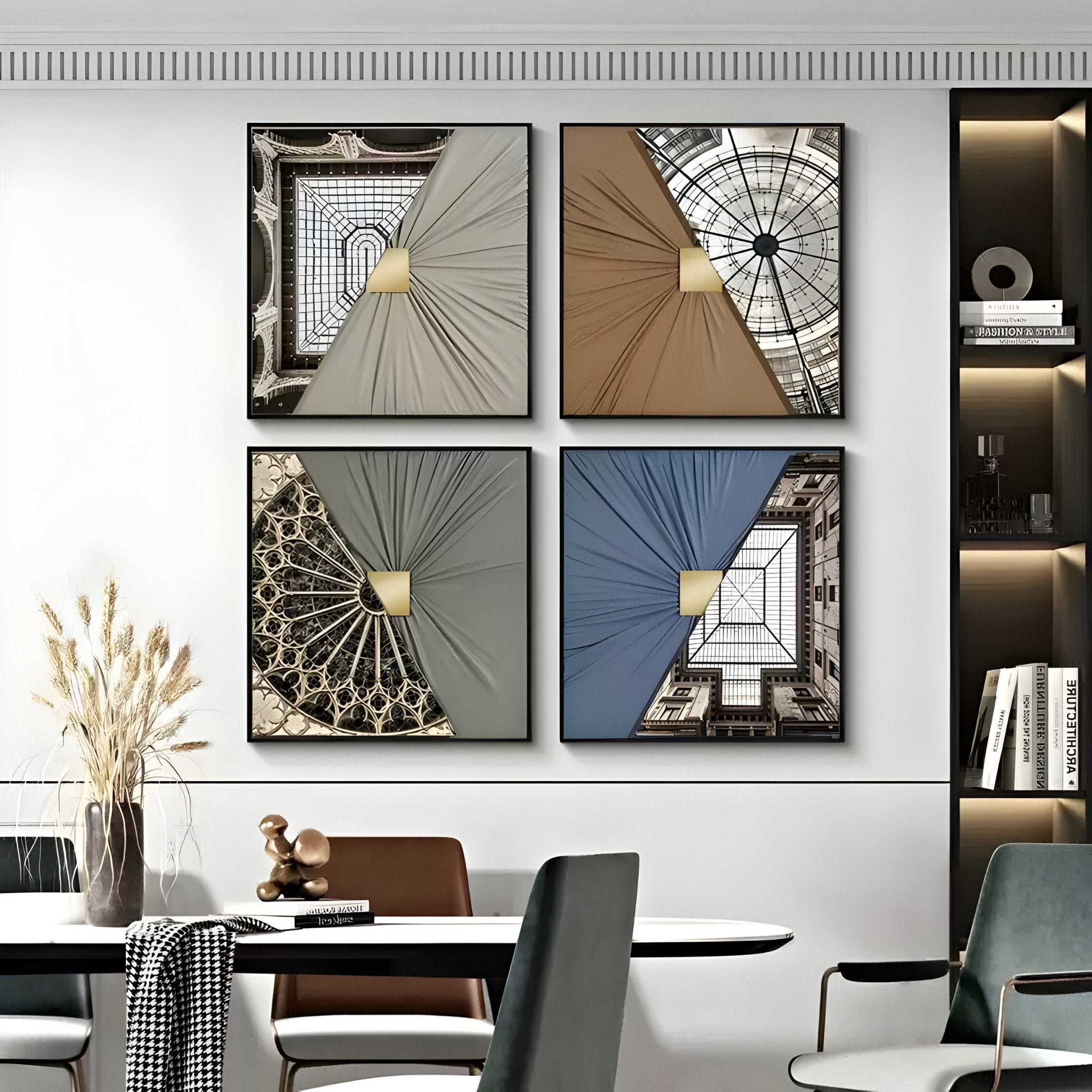 Four Urbanist 4-Set Vaulted Realms Acrylic & Leather 3D Wall Art pieces by Giant Sculptures hang above a dining table, displaying skylights and draped earth-tone fabric with gold accents. Shelves nearby hold books and decor.