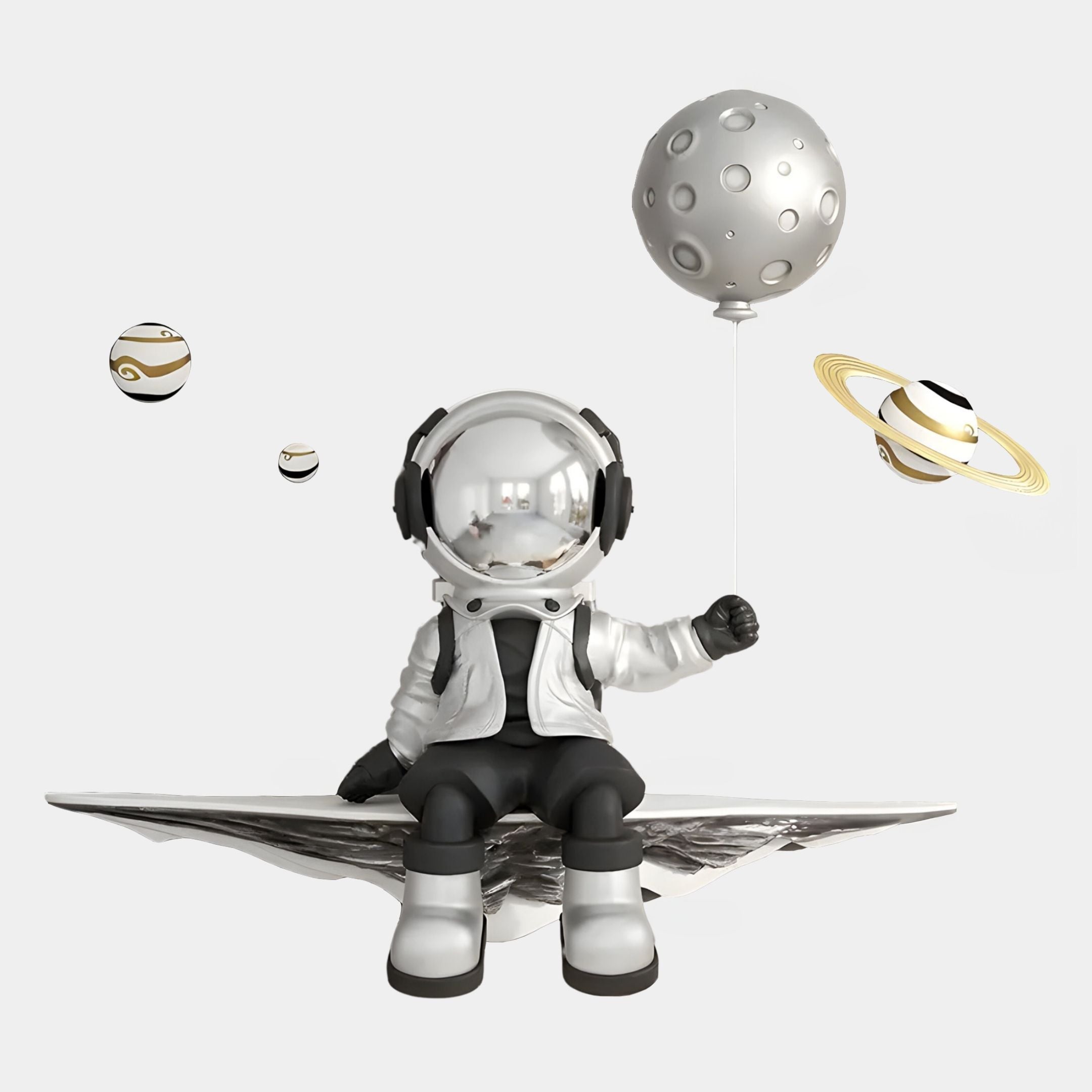 The Silver 3D Dreamer Balloon Astronaut Wall Art by Giant Sculptures features a metallic astronaut with a moon balloon and floating planets—a playful, space-inspired decor piece perfect for any wall.