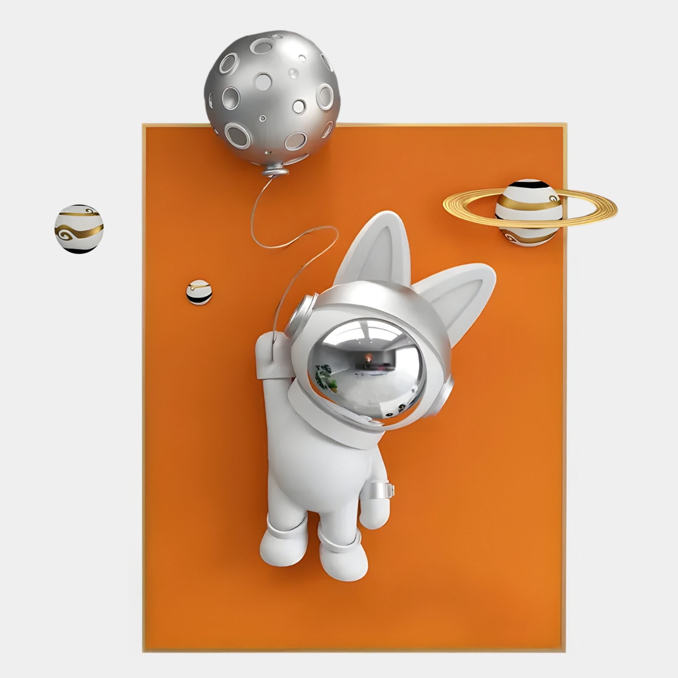 The Chrome 3D Astronaut Bunny Balloon Orange Wall Art by Giant Sculptures features a spacesuit-clad bunny floating above an orange rectangle, holding a moon balloon, with three stylized planets—including one with rings—around it.