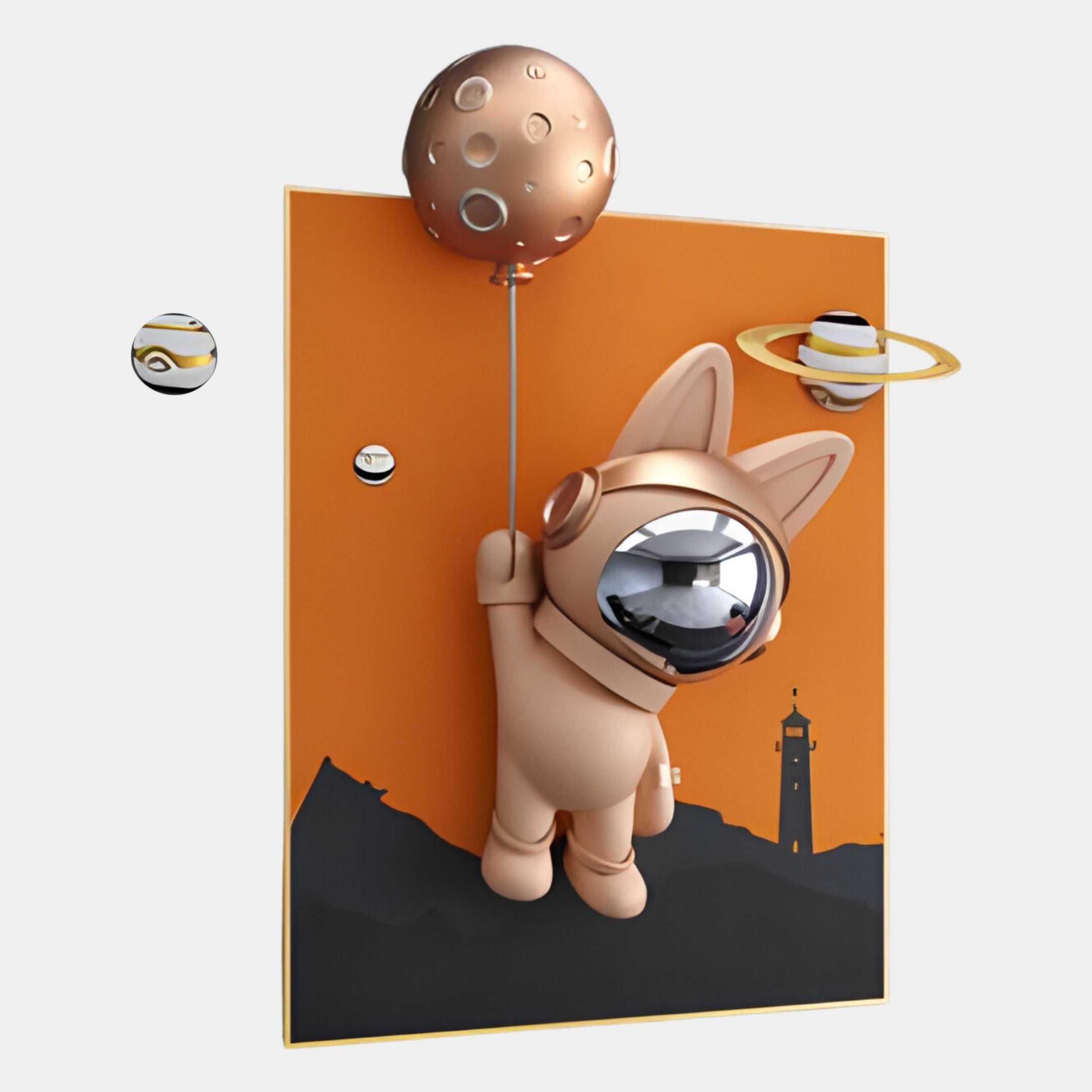 The Rose Gold 3D Astronaut Bunny Balloon Lighthouse Wall Art by Giant Sculptures features a bunny astronaut floating with a planet balloon before an orange sky, black mountains, lighthouse, and orbiting planets for space-themed décor.