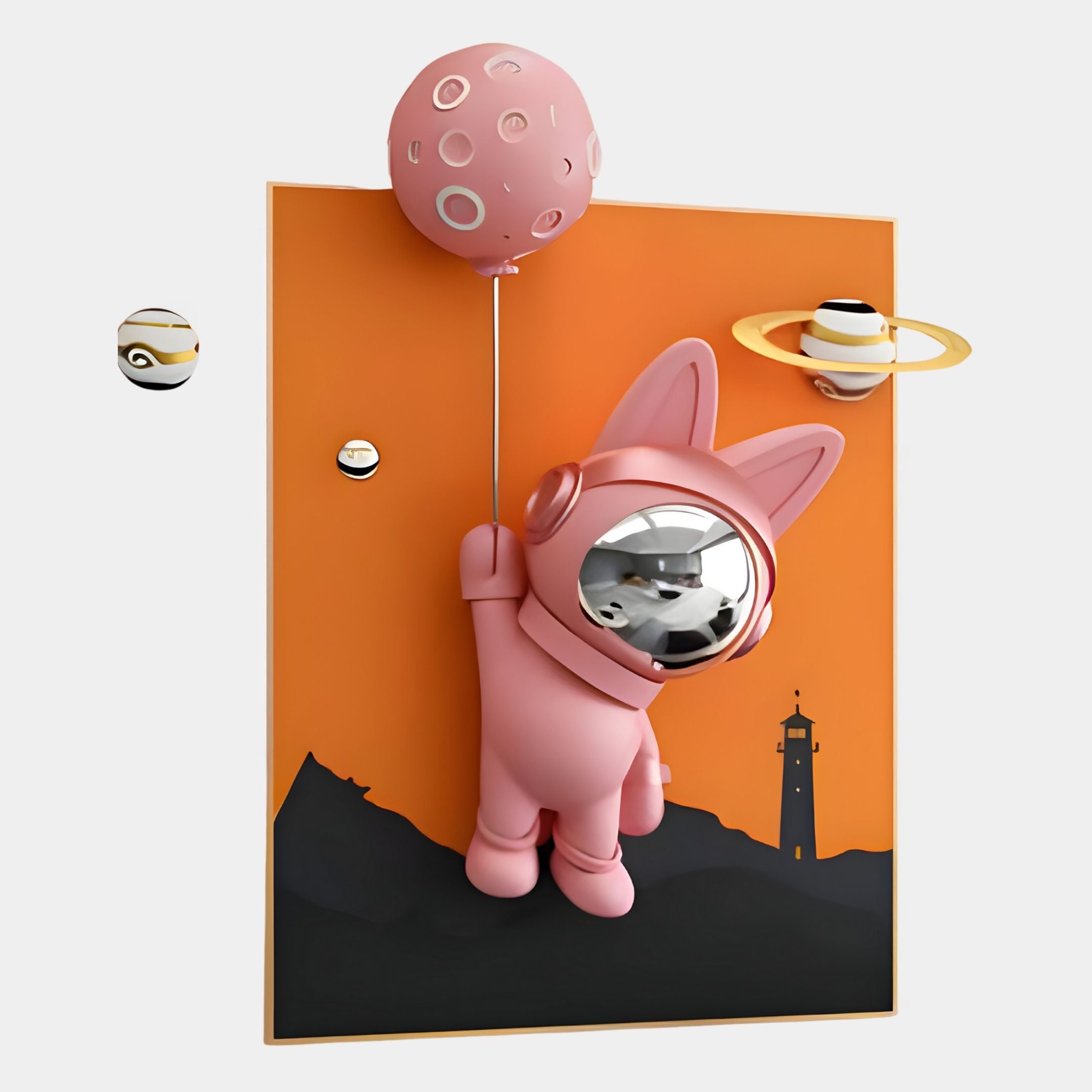 The Pink 3D Astronaut Bunny Balloon Lighthouse Wall Art by Giant Sculptures features a space-suited bunny floating with a pink planet balloon, set against an orange background with mountain and lighthouse silhouettes.
