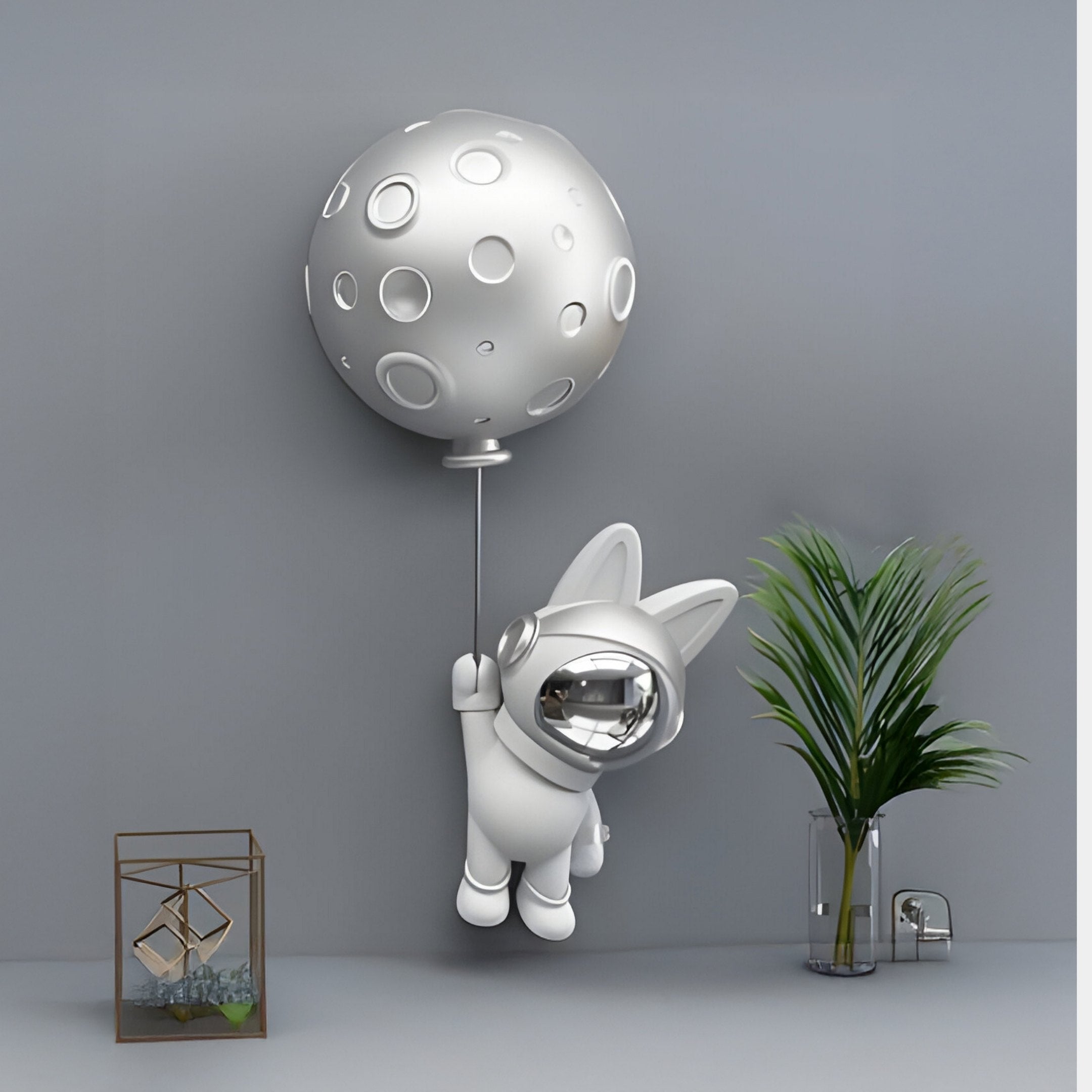 The Giant Sculptures Chrome Astronaut Bunny Balloon 3D Wall Art (58cm) features a cartoon bunny in a spacesuit with a moon balloon—an eye-catching piece for space-themed décor.