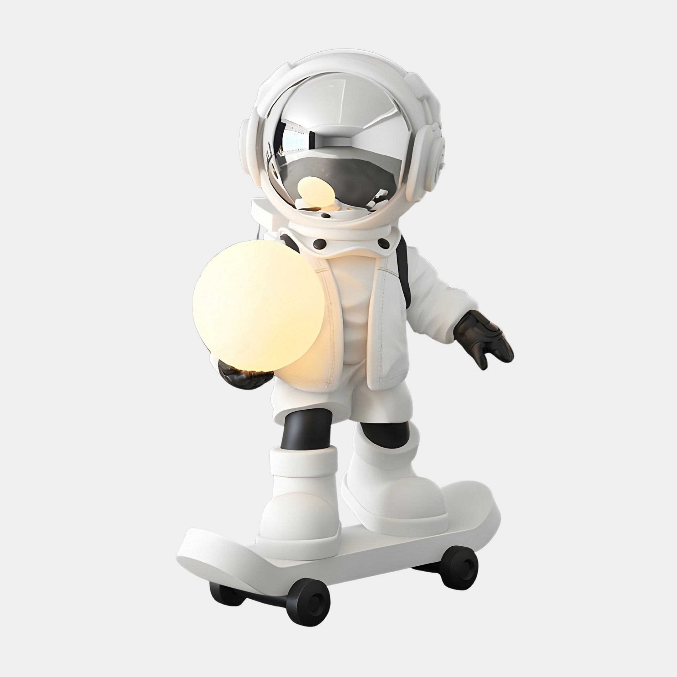 Nova White Skater Astronaut Glow Sculpture by Giant Sculptures, 80cm resin astronaut on a skateboard holding a warm glowing orb, white finish with black detailing, on a plain grey background.