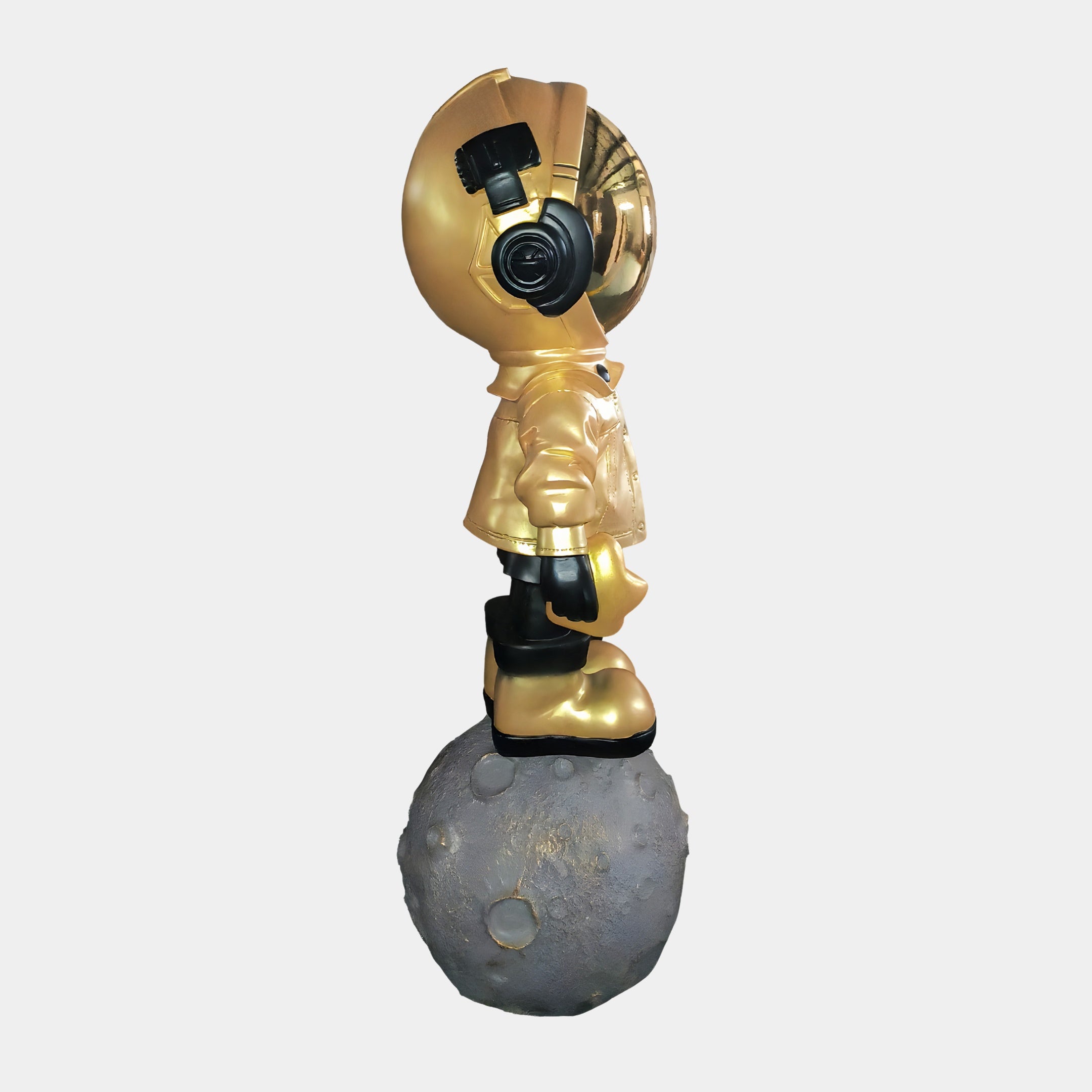 The Celestial Gold Astronaut Beats On Moon Sculpture (140cm) by Giant Sculptures features a striking gold astronaut standing on the moon, merging cosmic intrigue with modern art.