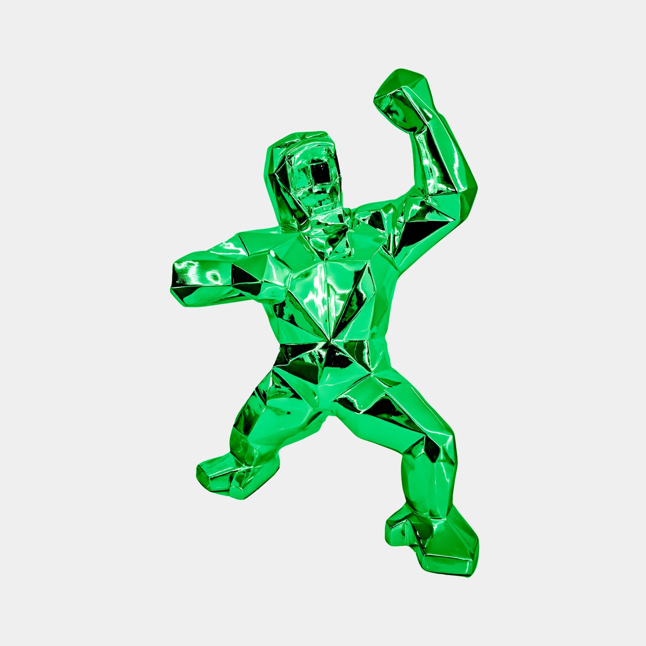 The Forrest Green Gorilla Sculpture - 50cm by Giant Sculptures has an electroplated finish, showcasing a human-like form with an open mouth and raised arm. The geometric lines add angularity, while the shiny surface enhances its dynamic and expressive presence.