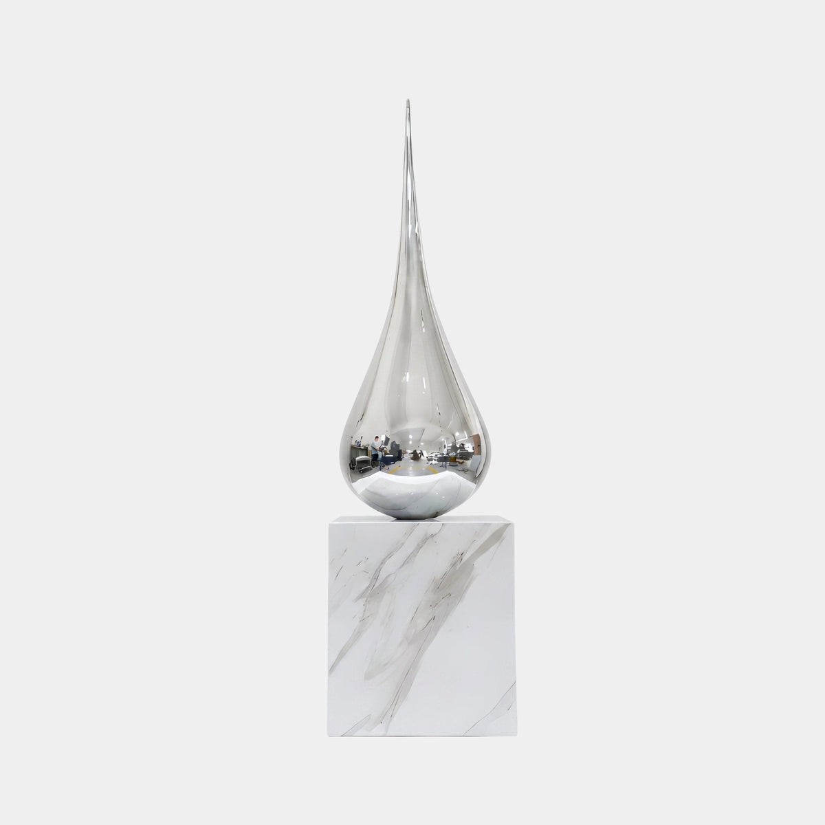 Bramhurst Silver Water Drop Sculpture - 110cm, a mirror-polished chrome teardrop on a white marble base, shown against a plain light background.