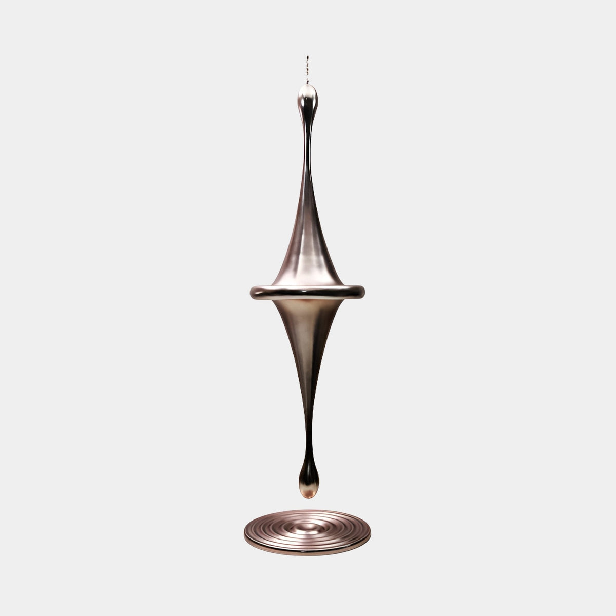 Brookstone Silver Abstract Sculpture - 135cm, a mirror-bright fibreglass spinner form with a ridged round base, shown on a plain light grey background.