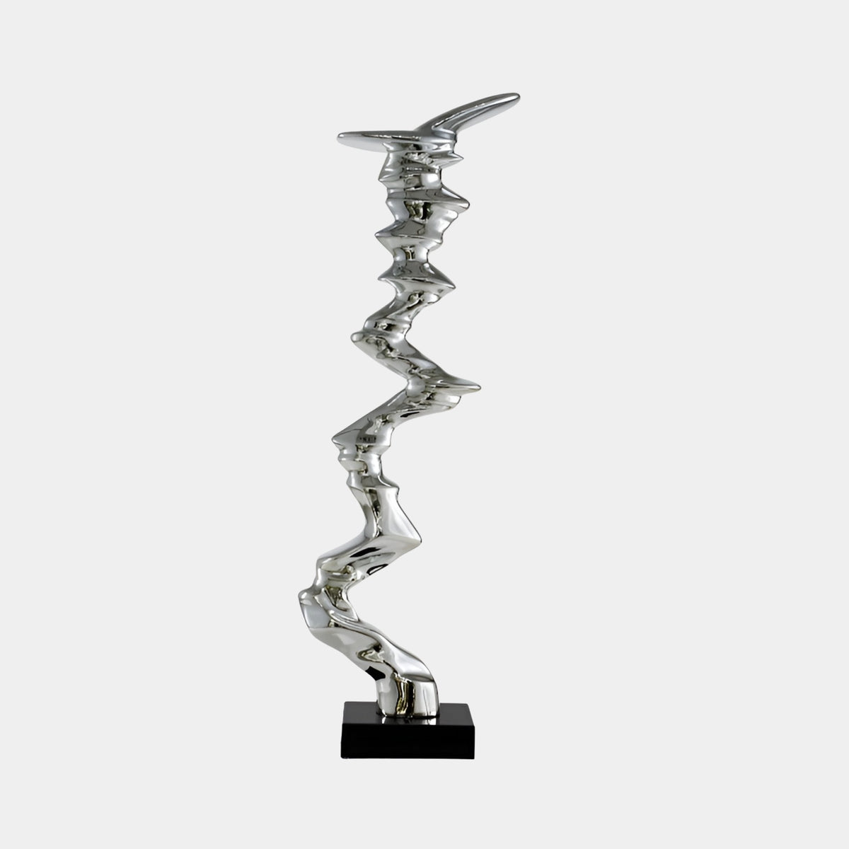 Burnridge Silver Abstract Sculpture - 126cm, a zigzag mirror-finish resin sculpture on a black base, shown against a plain light grey background.