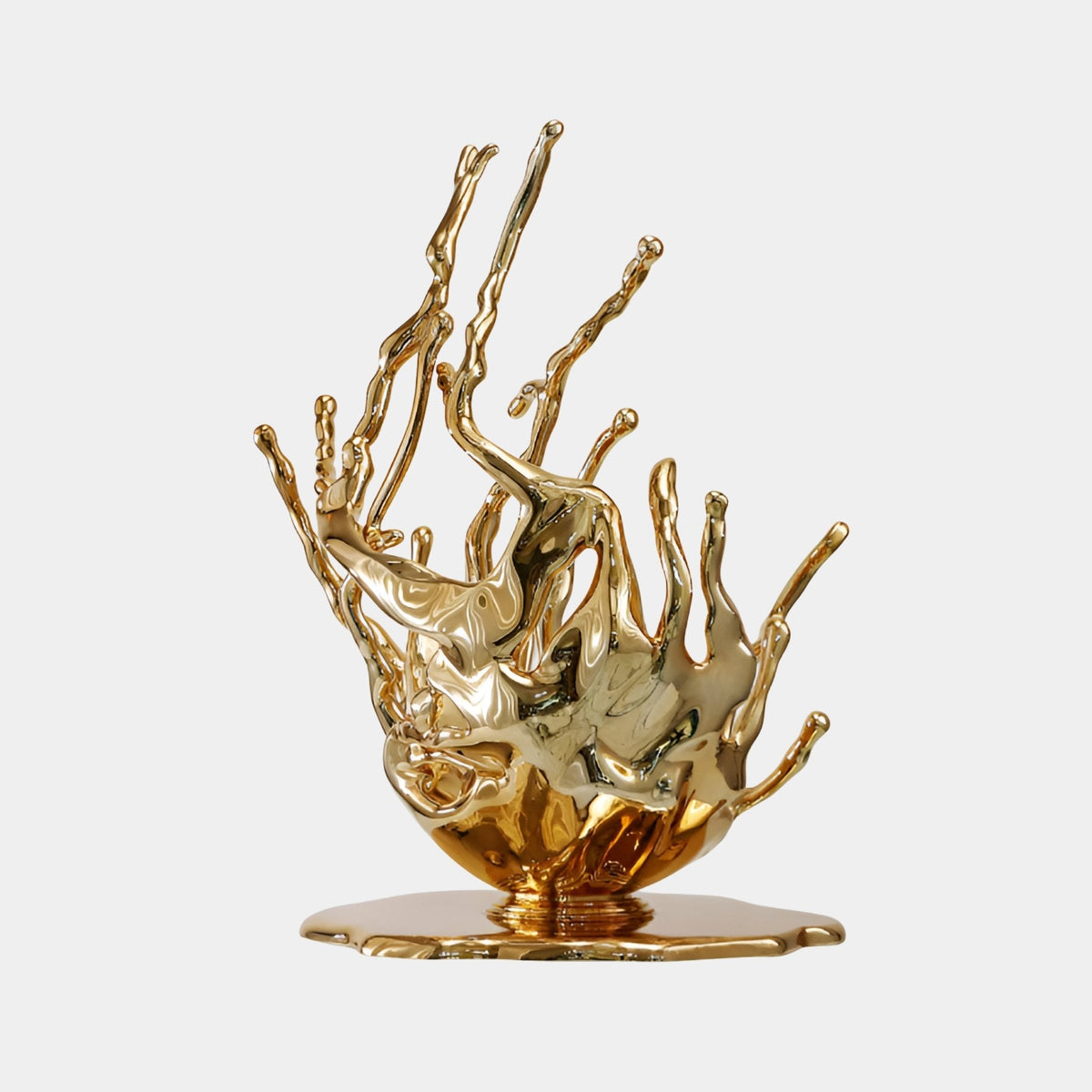 Burnstone Gold Abstract Sculpture - 121cm, a mirror-bright gold fibreglass coral-splash form on a round base, shown on a plain light grey background.