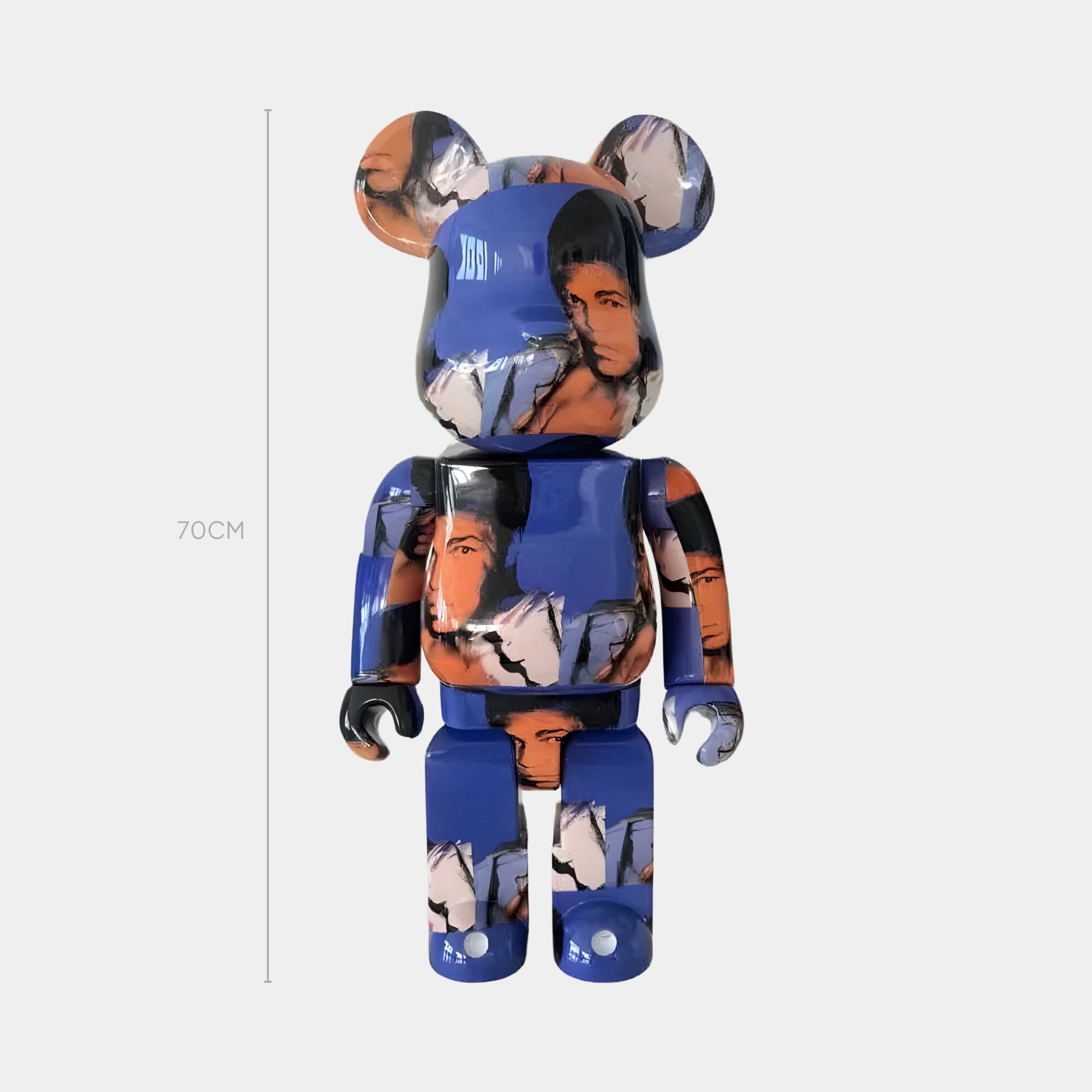 The Blue Mosaic Muse Bear Sculpture by Giant Sculptures stands 70cm tall, showcasing a glossy pop-art finish with abstract blue, orange, black, and white designs—an eye-catching contemporary piece against a light background.