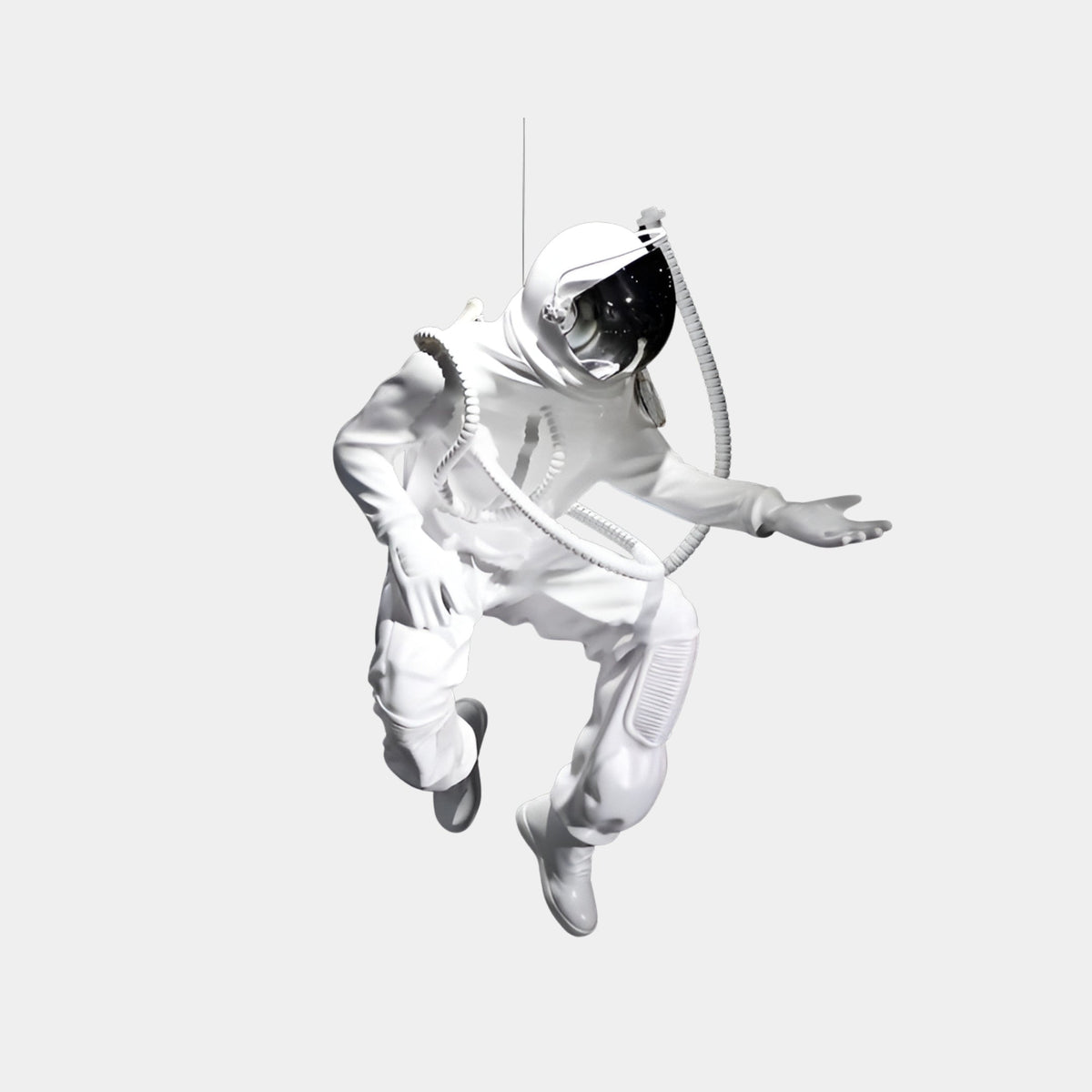 Eldham Silver Astronaut Sculpture - 120cm shown in a crouched floating pose with reflective visor and coiled cable, resin finish, on a plain light grey background.