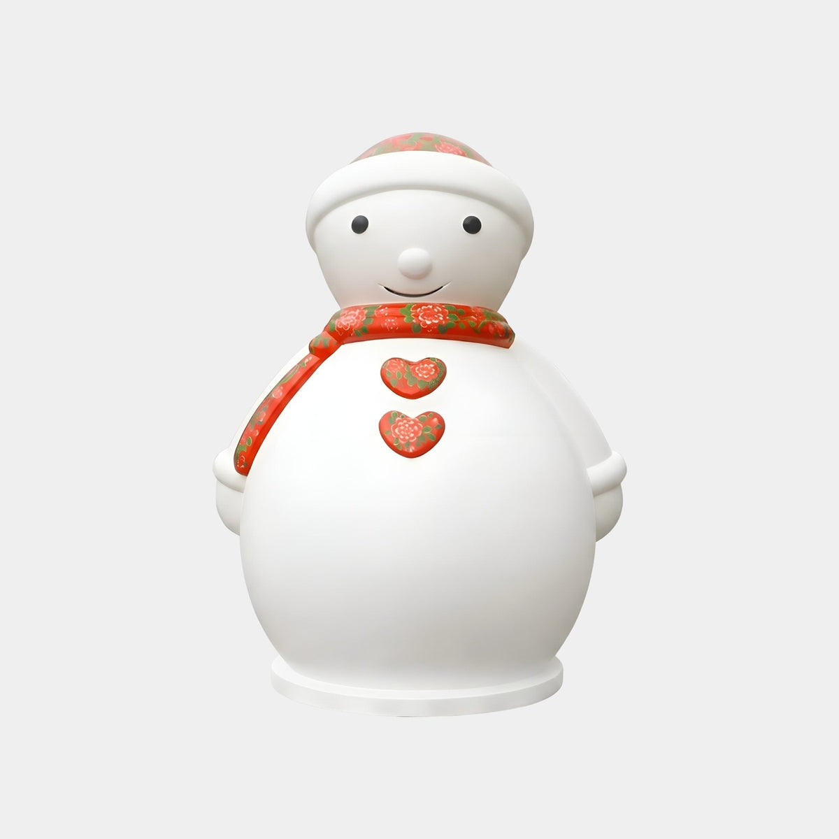 Marmere White & Red Snowman Sculpture - 155cm, a fibreglass figure with a red floral scarf, hat, and heart details, shown on a round base against a plain light background.