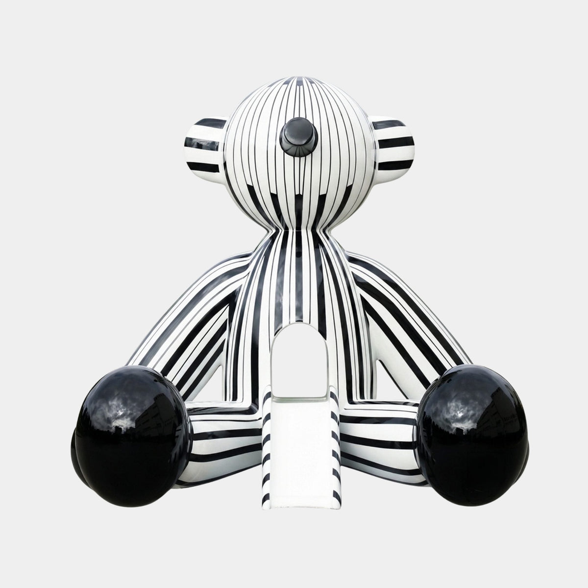 Oakfield Black Zebra Sculpture - 120cm, a striped black and white fibreglass figure with glossy black ball feet, shown front-facing on a plain light background.