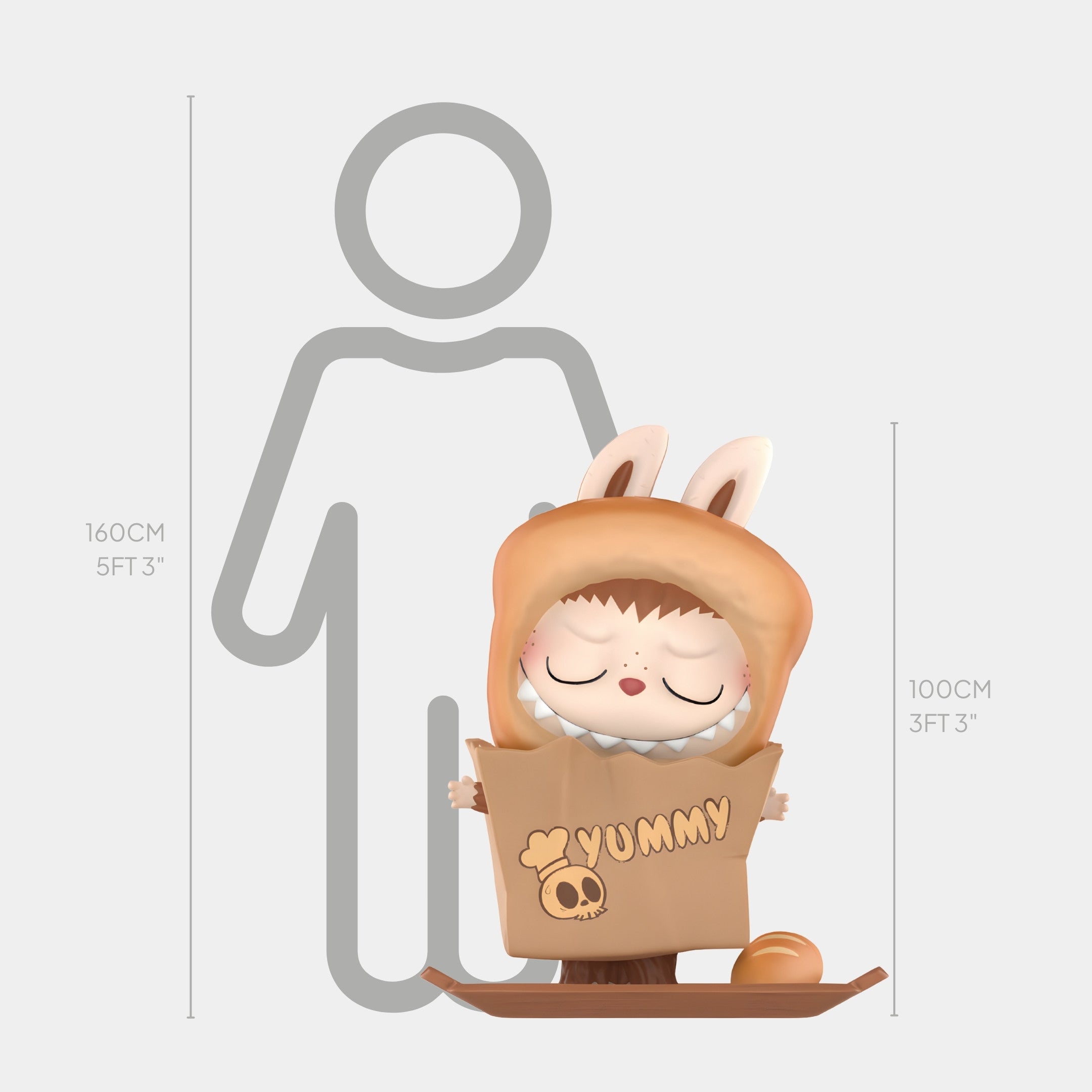 The Giant Sculptures Hidden Bread Bag Labubu Sculpture (100cm) features a small figurine in a brown animal costume holding a “Yummy” bag with a skull, inspired by a whimsical bakery theme.