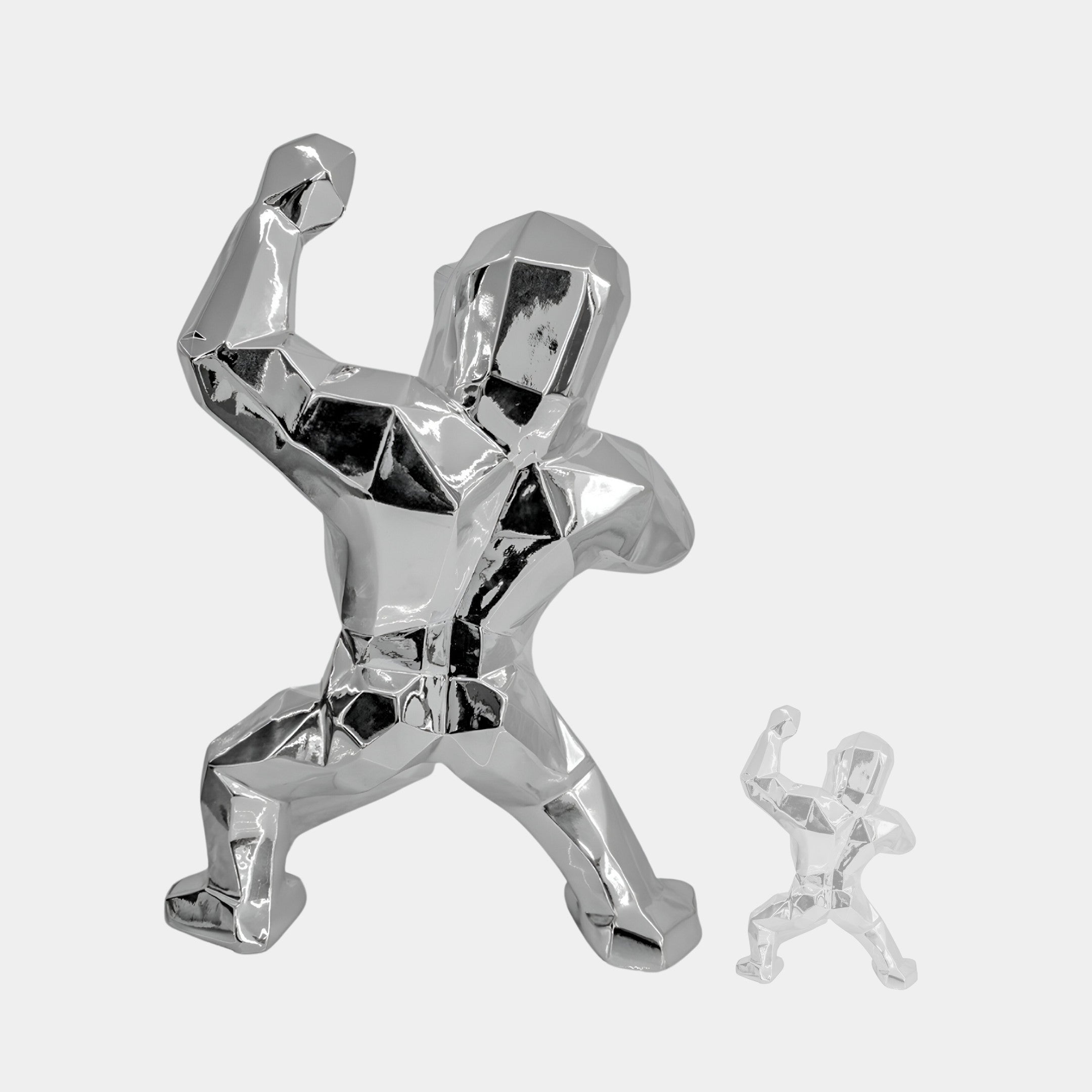 A large metallic sculpture with angular shapes strikes a dynamic pose, mirrored by Giant Sculptures Stellar Chrome Gorilla Sculpture (165cm). Both figures resemble muscular human forms in motion, ideal for ultra-modern interiors.