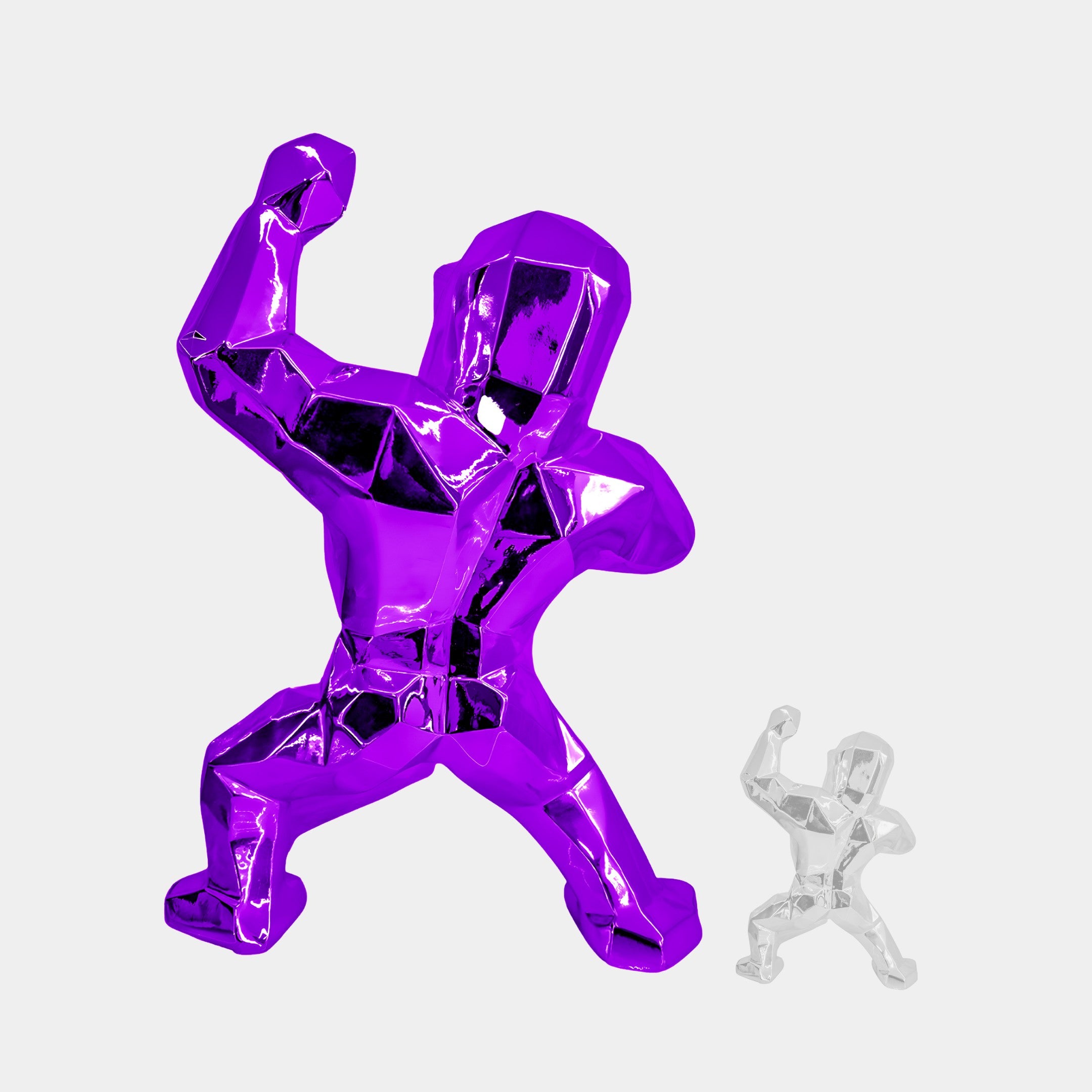 A large, faceted Phantom Purple Gorilla Sculpture (165cm) by Giant Sculptures stands next to a smaller matching silver fiberglass piece, both featuring geometric designs with angular surfaces.