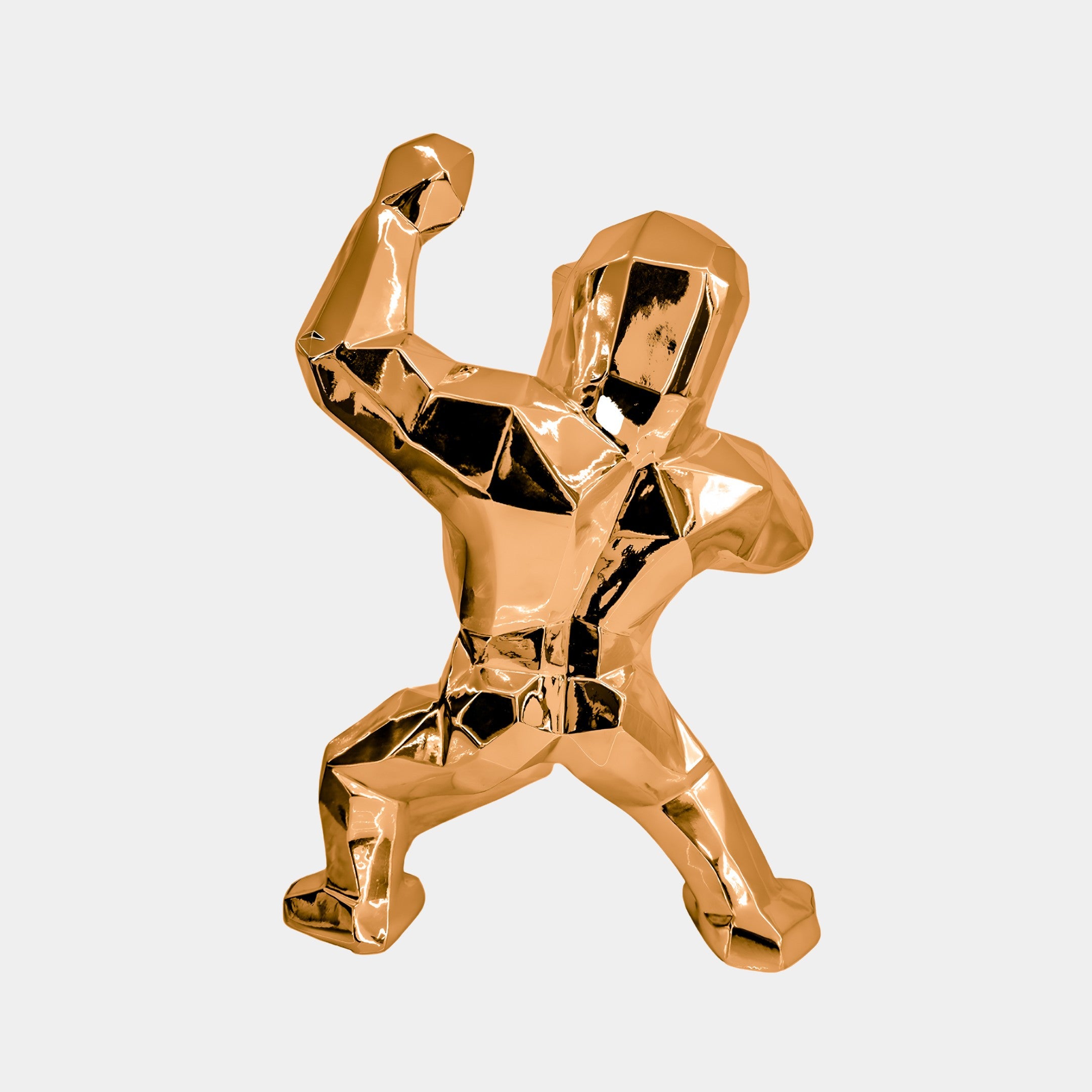 The Rose Gold Gorilla Sculpture by Giant Sculptures stands out with its muscular form and dynamic flexing pose. Its geometric facets and angular design highlight the contours, making it a striking 50cm modern centerpiece.