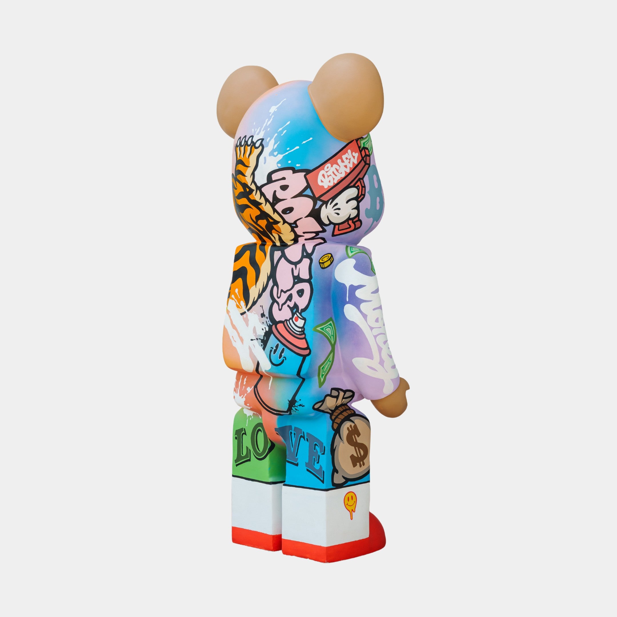 The Lucky Paws Bear Sculpture - 165cm by Giant Sculptures is a colorful, abstract bear against a plain background. It showcases vibrant graffiti-style Thai street art with text, symbols, and patterns in blue, orange, and purple hues—true luxury décor.